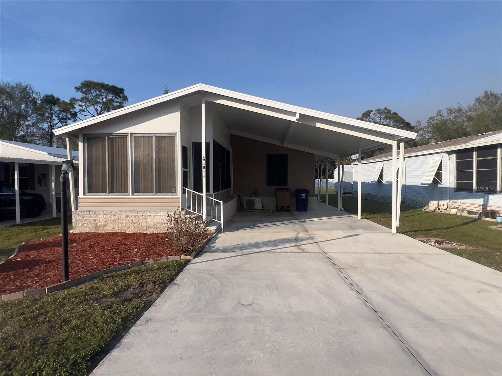 $20K Price Reduction! Located at 5054 Fiddleleaf Dr, this 2-bedroom, 2-bathroom home offers 1,114 square feet of living space and was built in 2005. Recent updates include a NEW roof, a NEW 40 gal hot water heater, a NEW toilet, and an NEW Delta kitchen faucet. This home also features a den area, as well as an enclosed sunroom area. The exterior of the home features a covered carport, an outside storage closet, in addition to an exterior shed. Located in Crystal Lakes community offering amenities such as community pool, clubhouse, bocce courts, pickleball & tennis courts. Community is golf cart friendly. Flood Zone X. Low HOA fees.