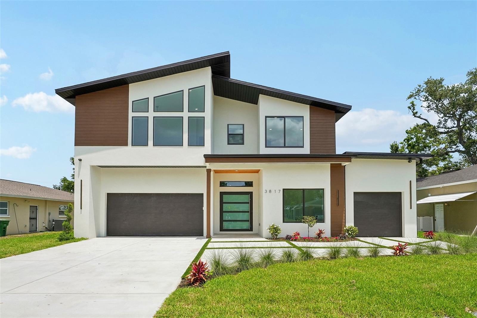 Welcome to your MODERN STYLE dream home in the heart of South Tampa—where luxury, comfort, and thoughtful design converge in this stunning brand-new construction. Boasting 5 spacious bedrooms, 4.5 modern bathrooms. This home offers the perfect layout for both entertaining and everyday living. Two primary suites with luxurious en-suite baths provide ideal flexibility for guests or multigenerational living, while the chef-inspired kitchen impresses with top-of-the-line THERMADOR APPLIANCES, elegant QUARTZ COUNTERTOPS, and abundant storage. Additional highlights include a 3-CAR GARAGE, impact-rated windows and sliding doors, a spacious UPSTAIRS LARGE BONUS ROOM, second-floor laundry, and a LARGE BACKYARD ready for your dream pool or outdoor oasis. Situated in the highly sought-after GRADY, COLEMAN, and PLANT school district, this smart, secure, and beautifully finished home presents a rare opportunity to enjoy upscale living in one of Tampa’s most desirable locations.