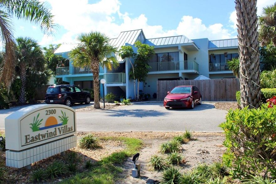 Beach-side Villa! Spacious 2nd floor 1 bedroom, 1 bath apartment with ceramic tile floors thru-out, washer/dryer hook-ups in unit, Very small, quiet community. Front wrap around balcony for spectacular sun rises and plenty of natural light. Stainless appliances: refrigerator, glass top range, dishwasher. Tiled bath. Grounds care included. Walk across street to Beach. PET FRIENDLY.