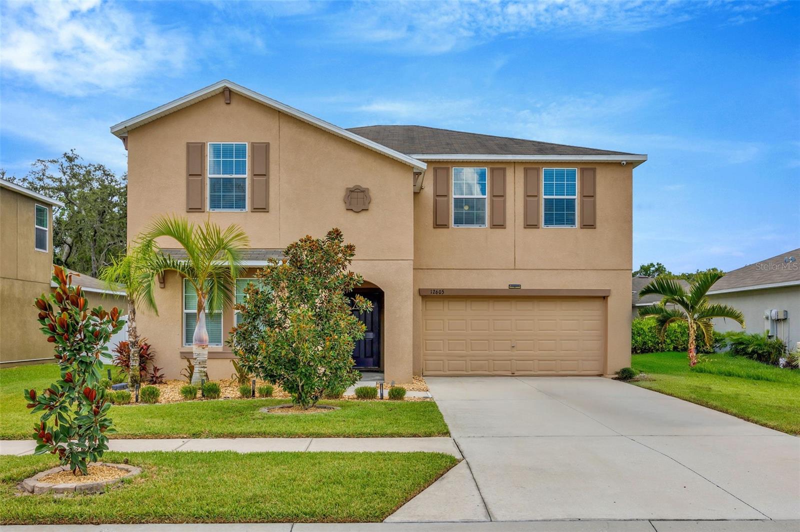 Welcome to 12605 Flatwood Creek Drive, a beautifully maintained and spacious two-story home located in the desirable gated community of The Preserve at Bullfrog Creek in Gibsonton, FL. Built in 2018, this expansive “Trenton” floor plan offers over 3,300 square feet of living space with six bedrooms and three full bathrooms, providing flexibility and comfort for growing families or multi-generational living. The first floor features a bright, open layout with tile flooring throughout the main areas, a large living and dining space, and a modern kitchen equipped with a brand-new stainless steel refrigerator (2024), 36" raised-panel cabinets, and a full washer and dryer package in a convenient first-floor laundry room.
The primary suite is located on the main level along with a secondary bedroom and a versatile flex room—perfect for a home office, guest room, or den. Upstairs, you'll find a massive loft and four additional bedrooms, offering ample space for relaxation, work, or play. The home includes upgraded energy-efficient systems like dual 15 SEER HVAC units, a programmable thermostat, in-wall pest control, and window blinds throughout. Additional storage and functionality come with garage shelving, hanging storage, and a second refrigerator—all included.
Outside, enjoy fresh landscaping in the front yard and unwind in the large backyard gazebo, perfect for entertaining or enjoying quiet evenings outdoors. The home sits on an oversized lot (approximately 60' x 115') and is part of a peaceful community featuring parks, a playground, and a community dock. With easy access to I-75, you're just minutes from shopping, dining, and downtown Tampa. This move-in-ready home blends modern convenience with style and space—making it the perfect place to call home.