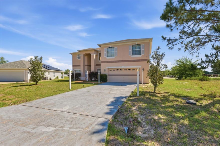 Welcome to this spacious and inviting 4-bedroom, 3-bathroom home offering over 2,500 square feet of living space on a generous 0.32-acre lot in Kissimmee!

Step inside and immediately be impressed by the soaring two-story family room, filled with natural light from oversized windows and enhanced by an open, airy layout—perfect for both relaxing and entertaining. The expansive living area flows seamlessly into the dining space and kitchen, creating a true heart-of-the-home feel.

The kitchen offers abundant cabinet and counter space, a functional layout, and a convenient breakfast bar overlooking the living area—ideal for casual dining and gatherings. A separate formal dining room provides the perfect setting for hosting holidays and special occasions.

This home features four generously sized bedrooms, including a spacious primary suite with ample room for a sitting area, along with a well-appointed en-suite bathroom featuring a soaking tub, separate shower, and dual vanities. Additional bedrooms provide flexibility for guests, a home office, or hobby space.

Enjoy the versatility of multiple living areas, including an upstairs loft/landing that can serve as a second living space, media room, or workspace. The home also includes a dedicated laundry room and plenty of storage throughout.

Outside, the large lot offers room to create your ideal outdoor oasis—whether it’s entertaining, gardening, or simply enjoying Florida living.

Additional highlights include:

Concrete block construction and two-story design
Open-concept layout with excellent natural light
High ceilings and spacious room sizes throughout
Established neighborhood setting

Conveniently located close to shopping, dining, and everyday amenities, and situated near highly rated schools, this home offers both comfort and convenience.

If you’re looking for space, functionality, and a dramatic open living area, this home checks all the boxes. Schedule your private showing today!