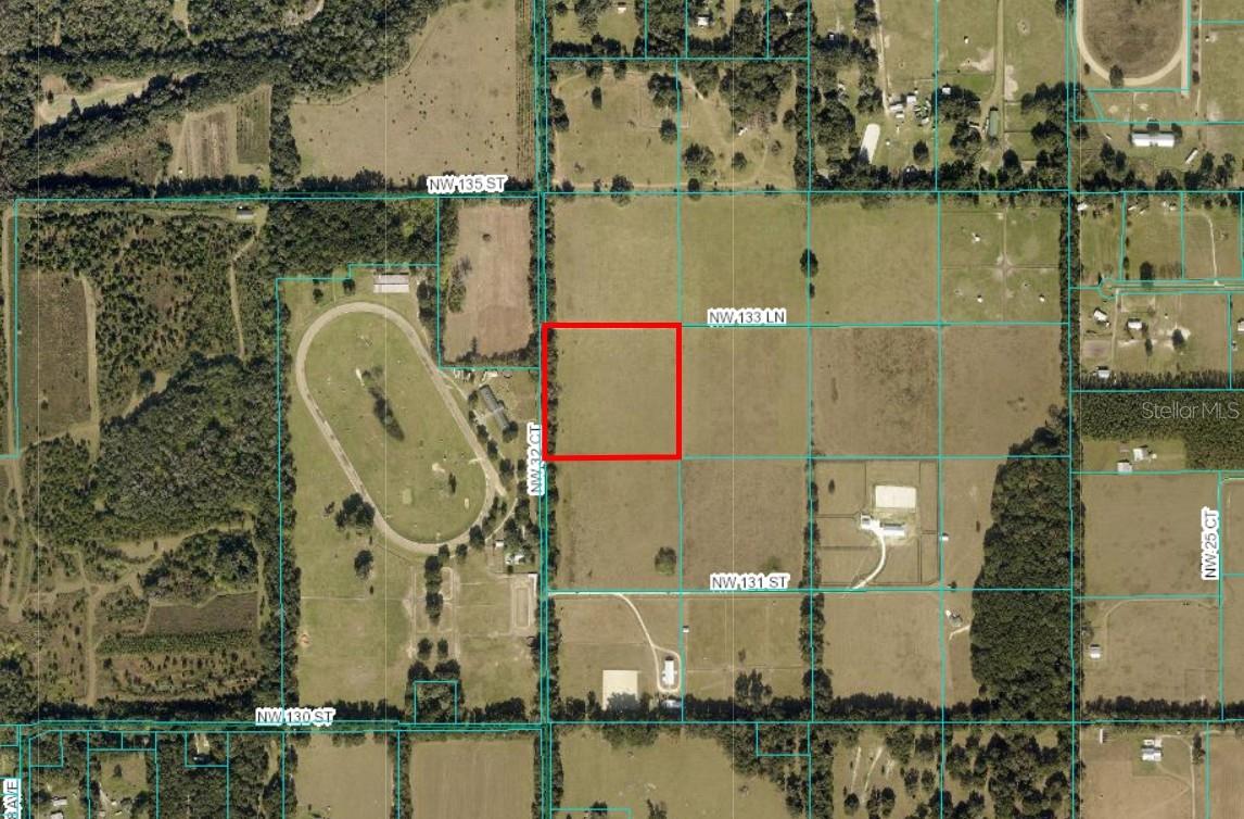 Check out this beautifully located 10.3 acres in the middle of Reddick's NW Horse Country. Part of a new Ag subdivision, Hammock Lane North, the perfect equestrian community with all lots being 10+acres. Property has trees on one side for privacy as well as a little roll to the land. 25 minutes to WEC, 14 minutes to WEC Jockey Club & Majestic Oaks, easy commute to downtown Ocala and Gainesville. Come build your dream farm!