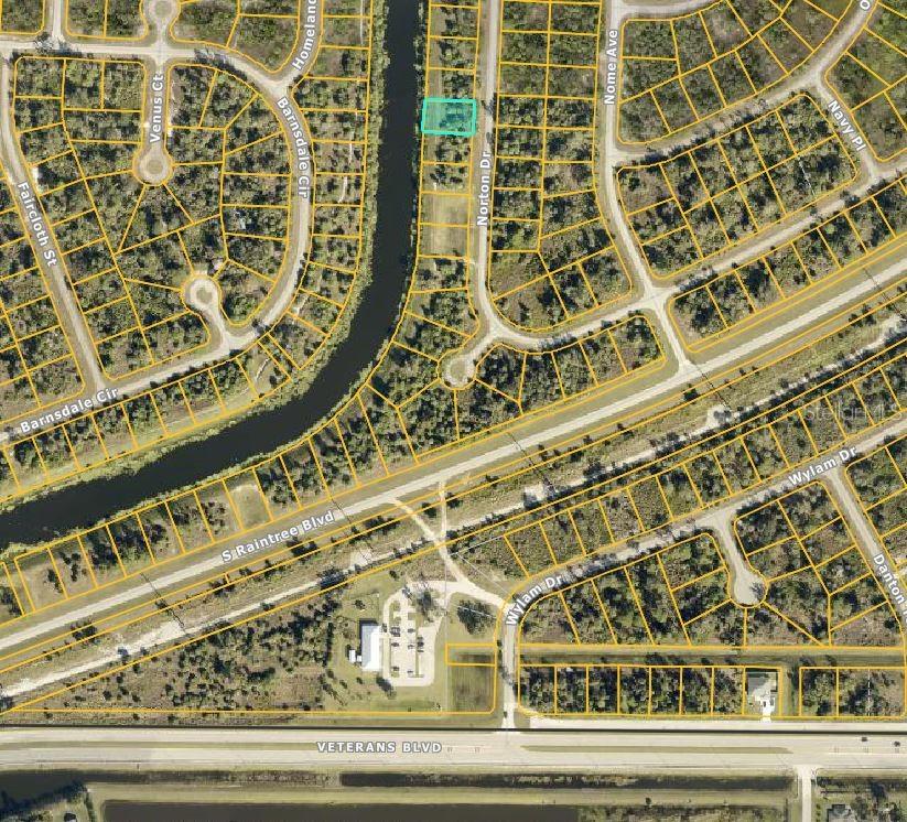 YOUR SEARCH FOR A WATER ACCESS LOT IS OVER! WELCOME TO YOUR FUTURE ADDRESS! YOUR BLANK CANVAS -- HOW WILL YOU DESIGN YOUR FUTURE HOME? This impressive 80x125 lot in the sought-after North Port offers this great space for designing the home of your dreams overlooking CocoPlum Canal where you can CANOE, KAYAK, FISH and BIRD WATCH with the heart of your youth! With generous dimensions to accommodate your boldest architectural visions, you have the perfect foundation to create a custom residence that embodies both style and functionality. Let Your Imagination Go Wild! Imagine a spacious layout featuring sunlit rooms, expansive outdoor living spaces, and a private backyard oasis where every detail reflects your personal taste. Nestled in a tranquil neighborhood yet conveniently close to top-rated schools, local amenities, and major transportation routes, this lot harmoniously blends serene suburban charm with everyday practicality. Here's Your Golden Opportunity! Seize this rare opportunity to build a home that’s as unique as you are—where every corner is tailored to your lifestyle and every detail is crafted with care. Start envisioning your dream home on this prime Norton lot today!