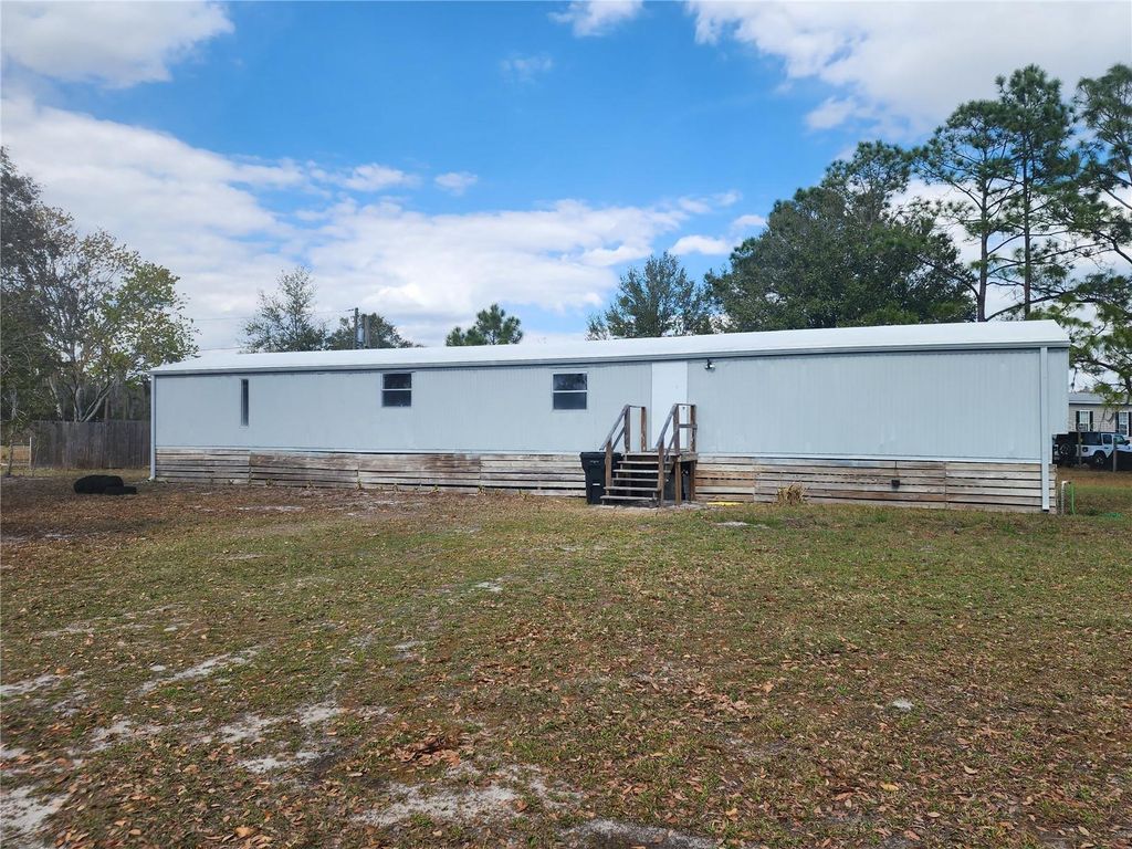 Photo of 3114 Holly Hill Cutoff Road, Davenport, FL 33837 (MLS # O6385983)