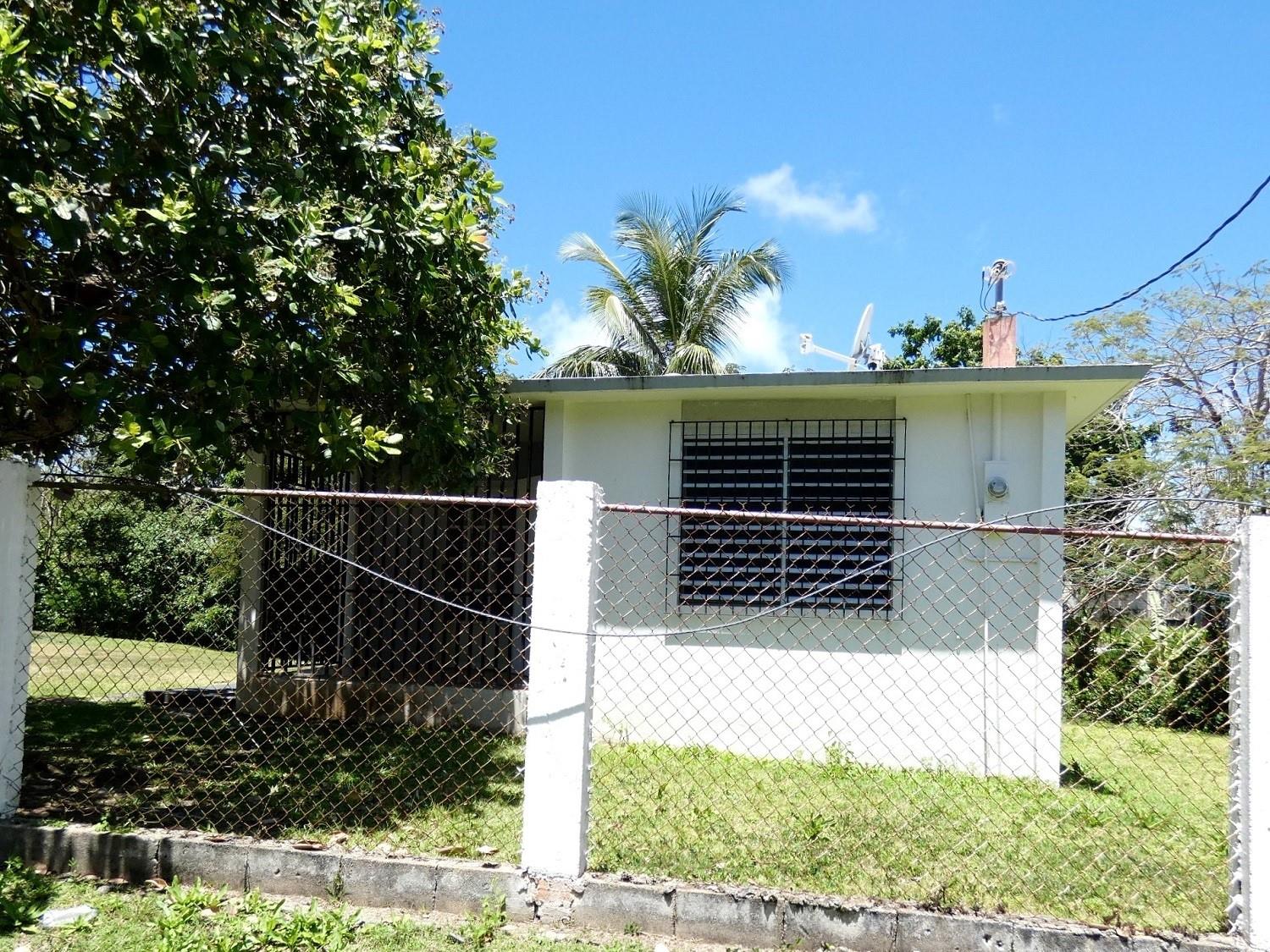 PASTORAL PIECE OF PARADISE! Two bedroom one bath home on half an acre in a quiet area of Monte Santo. Solid, clean and well maintained. Closets in both bedrooms! The 2,199.7266 square meter lot offers plenty of room to expand, grow a garden, raise animals, or put in a pool. Small creek in the back of the property promises fireflies and coqui frogs. Private, yet conveniently located near shopping, restaurants and gas stations. Best listing available in this price range! Titled & mortgage-able. PRICE REDUCED!!!