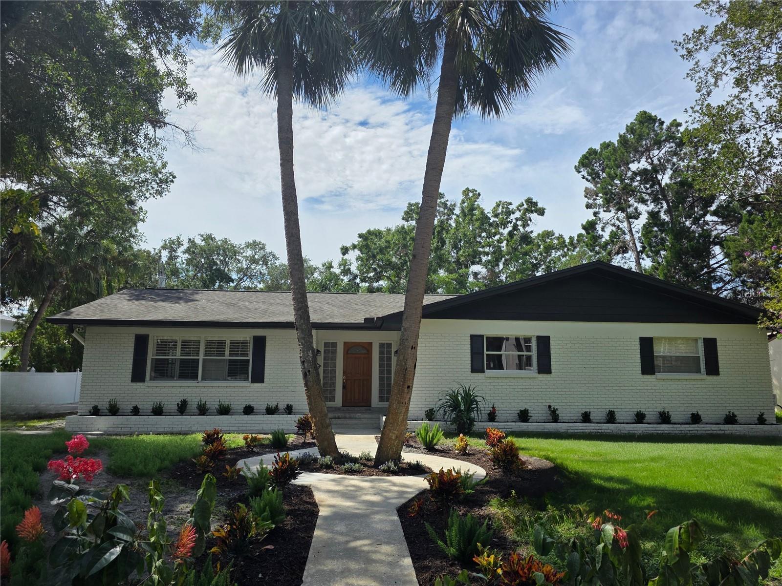 One or more photo(s) has been virtually staged. Welcome to this rare Sunset Park rental opportunity! Nestled on nearly a quarter-acre private homesite, this South Tampa pool home combines comfort, style & convenience. Featuring 3 bedrooms plus a versatile den/office, 2.5 baths, and a 2-car garage, the home offers both functional living and modern upgrades. Inside, you’ll find gorgeous wood-look plank tile flooring throughout, custom plantation shutters, a separate formal living room, and a spacious family room with fireplace. The gourmet kitchen is the heart of the home with quartz countertops, a massive island, 42-inch cabinetry, tiled backsplash, stainless steel appliances including a Sub-Zero refrigerator and gas range, plus a wet bar for entertaining. Glass French doors lead to the screened lanai overlooking the sparkling pool, surrounded by new custom pavers and a fenced backyard for privacy. The primary suite offers direct pool access and a luxurious spa-inspired bath with a walk-in tiled shower, rainfall shower head, and stand-alone soaking tub. Located in the highly sought-after Plant High/Coleman Middle/Mabry Elementary district, this home provides quick access to all that Tampa has to offer, shopping, dining, entertainment, and more!