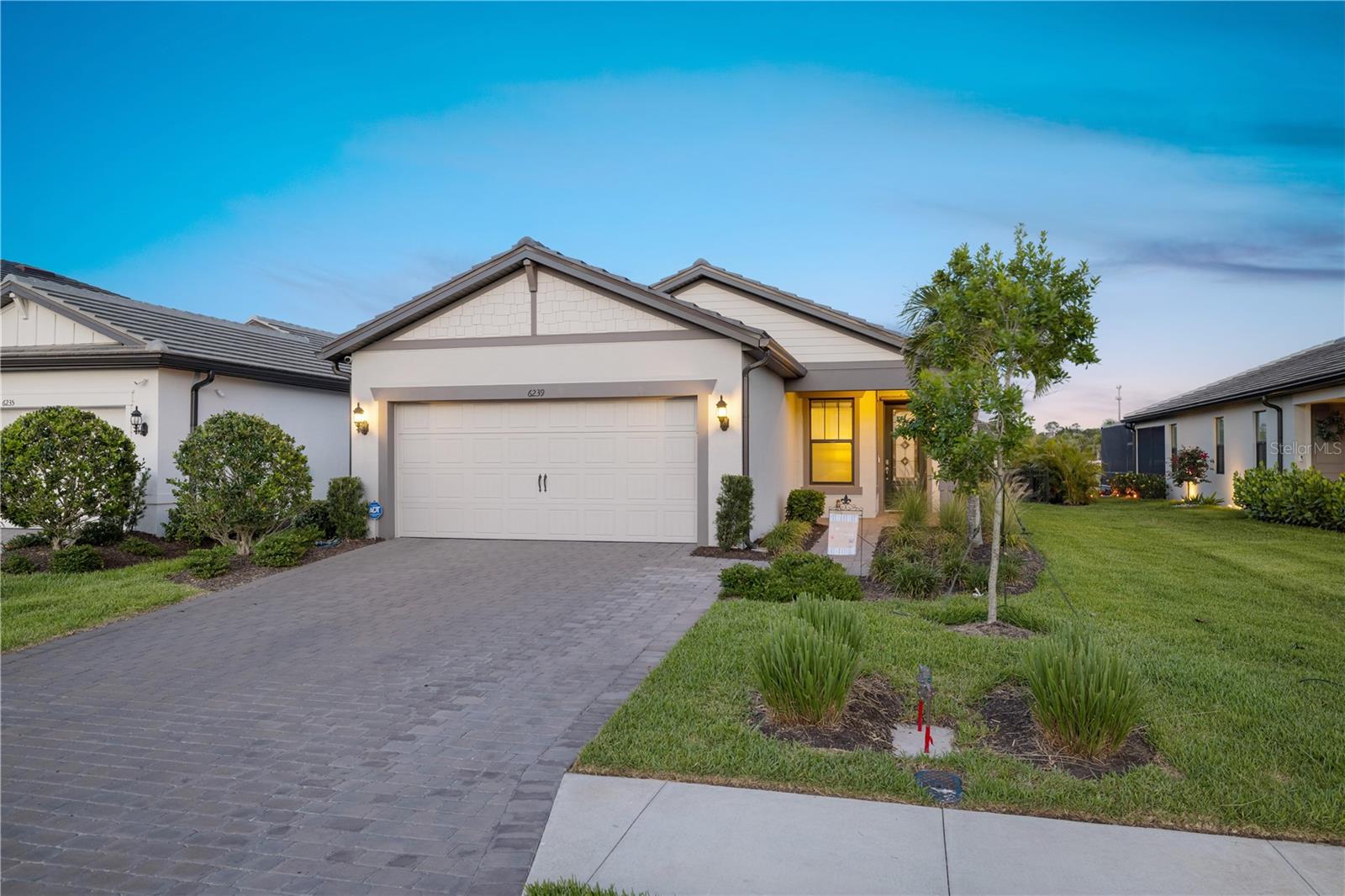 Get a FREE $10,000 GOLF CART with the purchase of this home! Welcome to the beautiful gated community of Sapphire Point in Lakewood Ranch—one of Southwest Florida’s most sought-after master-planned communities. The Crestwood floor plan is a one-story residence that is thoughtfully designed to offer comfort, flexibility, and style, making it an ideal home for families and those who love to entertain.
The home features two spacious bedrooms, a versatile den perfect for a home office or guest room, two full bathrooms, and a 2-car garage. The open-concept layout allows for a seamless connection between the kitchen, dining, and living areas, creating the perfect environment for casual get-togethers or relaxed evenings at home. The chef’s kitchen features a center island, stainless steel appliances, upgraded white shaker-style cabinetry, and elegant quartz countertops.
The primary bedroom is a private retreat, featuring a dropped tray ceiling, a luxurious bathroom with dual sinks, a sleek glass-enclosed shower, and a walk-in closet that offers ample storage. The main living and wet areas are finished with durable porcelain tile, while plush carpeting adds warmth to the bedrooms. Step out onto the covered and screened-in lanai, perfect for outdoor dining or relaxing in the Florida sunshine. Upgrades include luxurious fans, light fixtures, and draperies. There's even room to add a pool to complete your personal oasis.
Sapphire Point offers residents access to incredible resort-style amenities, including a sparkling community pool, a clubhouse with a fitness center, a playground, a basketball court, a fire pit, and an event space. Located just north of State Road 70, you’re minutes from top-rated schools, dining, shopping, golf courses, parks, and the cultural and coastal delights of Sarasota and Manatee counties.
6239 Baywood Ct blends laid-back luxury with practical design in a community that truly offers it all. Make this Lakewood Ranch gem your forever home or seasonal escape.