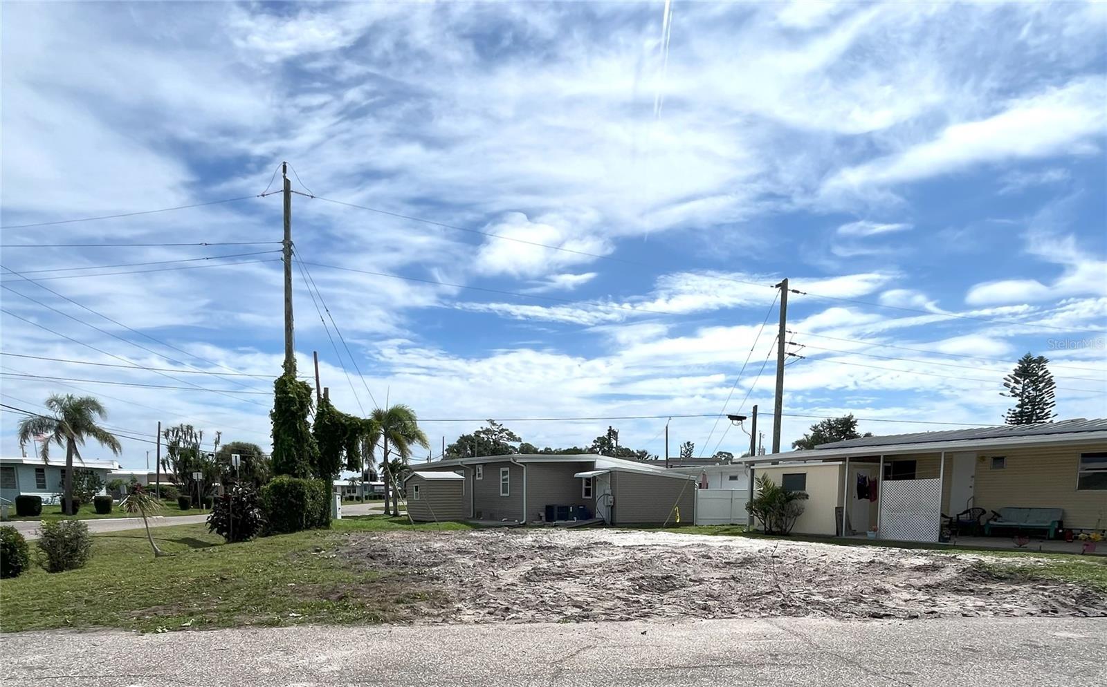 Oversized lot ready for your new build in Sarasota Bay’s premier 55+ marina community. Property is owned—no lot rent—and sized for a custom home with garage. Combine land and build financing. Located near the bay, marina, pool, and activity center. Enjoy a coastal lifestyle with beach pavilion, hot tub, fitness center, and 60+ clubs. Trailer Estates is a Special Park and Recreation District under Chapter 418, Florida Statutes. Annual tax includes cable, internet, and trash. Subject to 55+ community rules. Don’t miss this opportunity!
