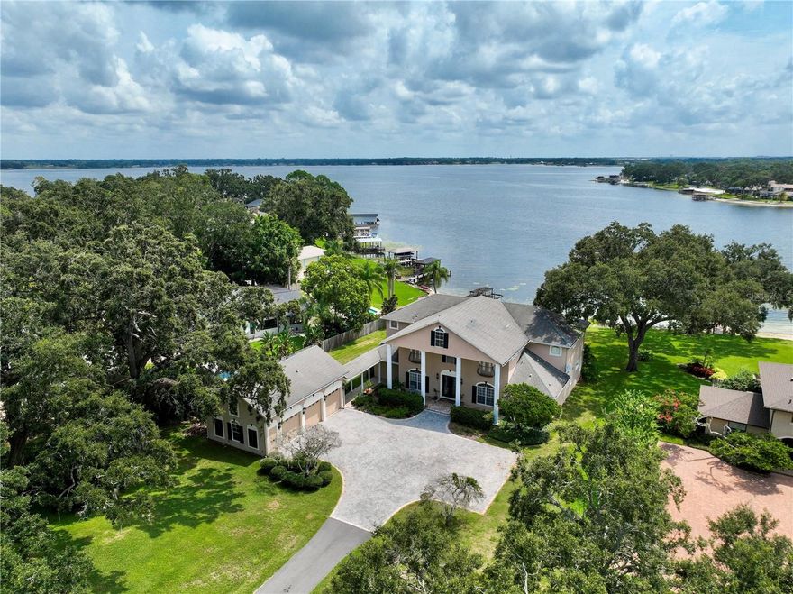 Fabulous Estate on The Conway Chain of Lakes. Amazing 4 bedroom 4.5 bath home w/ 4898 sq. ft. sits on a 1.32 acre lot with 120' of lakefront offering a million dollar view. Formal living & dining rooms and an elegant grand staircase. Stunning kitchen w/ stainless and granite overlooking huge family room with amazing views of the lake. Step out to a big covered porch with large patio to enjoy the private back yard. Two awesome master suites one up and one down with jetted tubs separate showers and double closets. Upstairs master steps out to screen balcony. Two additional bedrooms w/ Jack and Jill bath plus a huge home theater room. Attached three car garage has a 483 sq. ft one bedroom apartment above w/efficiency kitchen, washer/dryer plus your own balcony. Located between Downtown & International Airport in small city of Belle Isle, features Cornerstone Charter School. This is a one of a kind property.