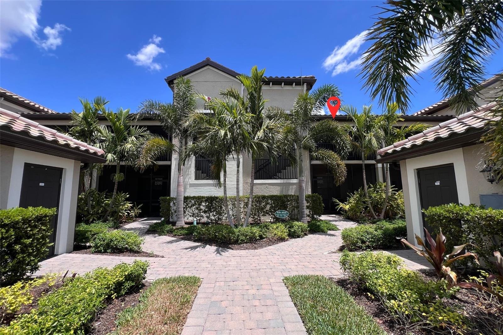 Golf front and lake front living all day every day in Lakewood National Golf Club! Luxurious golf and resort lifestyle maintenance-free community along the Arnold Palmer designed championship golf course where residents receive deeded access to two 18-hole championship golf courses. Light, airy, calm vibes throughout this roomy 2bd 2ba + den condo home. The grand kitchen island is the heart of this home's open flow floor plan. Quartz countertops throughout. High ceilings not only give spatial perception, they also add light and improve circulation and ventilation. Crown molding gives the finishing touch of elegance and sophistication. Private den is roomy and ideal as a transitional third bedroom. Front lanai faces west. Back lanai faces east. Includes one-car garage with room for extra storage. The large windows and open air living spaces give you around the clock views of lush landscapes, natural rolling terrain, blue skies, sunrises, and sunsets. When golf isn't on your schedule you can meander to the satellite pool at the end of your building, the 28,000 sq ft grand clubhouse, beach entry lagoon pool, elegant dining room, beachside tiki cafe, full-service spa, lighted Har-tru clay tennis courts, state-of-the-art fitness center that's open 24 hours, pickleball, and pro golf and tennis shops. Full-time, onsite golf, fitness, and racquet sports professionals are available to members! Lakewood Ranch Premier Sports Complex is 2.2 miles near which offers 140 acres of Celebration-seeded grass, 23 mixed-use fields and endless fun for sports enthusiasts, athletes, and spectators alike. It has every field sport under the sun for athletes ranging from youth to professional, tournaments and practices. International, national, state and regional events have all taken place on the fields. Aside from everything sports, family-friendly events like outdoor festivals and movie nights are also hosted here. Sarasota Polo Club is 8.3 miles south with 170 acres of perfectly manicured grounds, 7 world-class polo fields, and a regulation size arena. The Gulf Coast beaches at Anna Maria Island to Lido to Siesta Key are 24.7 miles to your west. Experiences of a lifetime are waiting for you here where you may have a few sharkies on the course but shouldn't have too many barkies! Most furnishings included with a few personal exceptions.