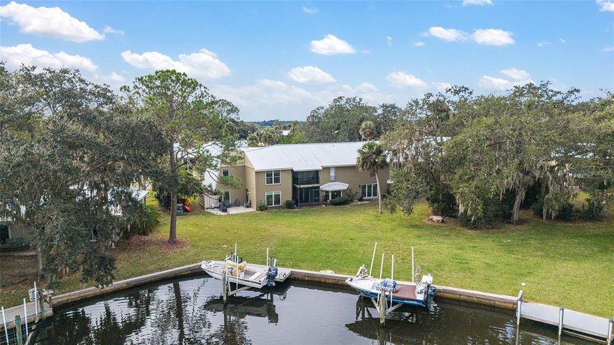 Waterfront Townhouse with Private Dock & Boat Lift and Direct Gulf Access! Welcome to your rare waterfront retreat in The Islands at Dixie Shores! This beautifully renovated 3-bedroom, 2.5-bath end-unit townhouse condo offers direct Gulf of Mexico access via a wide saltwater canal and includes a private dock with a boat lift perfect for vessels up to 24 feet. Whether you're a boating enthusiast, avid fisherman, or nature lover, this waterfront property delivers the ultimate Florida lifestyle. Fully updated in 2025, this spacious home features sunlit living areas with panoramic water views, wood-look tile plank flooring, and elegant architectural details. The chef’s kitchen boasts granite countertops, stainless-steel appliances, shaker cabinetry, and a custom tile backsplash. Enjoy meals with a view in the dining area framed by oversized picture windows overlooking the canal. Upstairs, the owner’s suite is a serene escape with tranquil waterfront vistas, double closets, and a spa-inspired ensuite bath. Additional highlights include two new AC units, a new water heater, all new appliances, and a flood barrier doorway system for added peace of mind. The Islands condo community offers resort-style amenities including a clubhouse, heated pool, tennis courts, and comprehensive services—cable/internet, flood insurance, exterior maintenance, landscaping, termite bond, roof and road upkeep, and on-site management. Located minutes from Fort Island Beach, Three Sisters Springs, Hunter Springs, Plantation Golf Course, and public boat ramps, this turn-key property is your gateway to coastal adventure. Furnishings are available for purchase, so just bring your boat and start living the waterfront dream!