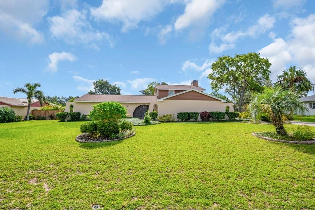 Welcome to your dream home in the custom community of Brandonwood! Nestled on a high and dry HALF-ACRE LOT, this 4-BEDROOM, 2.5 BATH POOL HOME offers nearly 2,400 square feet of thoughtfully designed living space—perfect for both entertaining and everyday comfort. The PRIMARY SUITE IS CONVENIENTLY LOCATED DOWNSTAIRS and features laminate floors, two walk-in closets and an updated ensuite bathroom with granite counters and a modern walk-in shower. Just steps away, a versatile OFFICE WITH DOUBLE DOORS and laminate flooring makes an ideal work-from-home space, reading room, or even a cozy nursery. This room could be a 5th bedroom as it comes complete with a built-in closet. The heart of the home is a SPACIOUS KITCHEN filled with oak cabinetry, SOFT-CLOSE DRAWERS, two lazy Susans, and pull-out shelves for effortless organization. GRANITE COUNTERTOPS, a tile backsplash, and a roomy eat-in area complete this chef-friendly space. Don’t miss the large utility room with extra storage and sink and the half bath around the corner. Entertain with ease in the separate FORMAL LIVING AND DINING AREAS or gather in the LARGE FAMILY ROOM (did you notice the wood-burning fireplace?) that opens directly to a SCREENED LANAI—perfect for year-round outdoor living. Beyond the lanai, you'll find a HUGE INGROUND POOL, large enough for the whole family to splash, swim, and unwind. Love to garden? This spacious lot offers PLENTY OF ROOM TO GROW YOUR OWN VEGETABLES, HERBS AND FLOWERS. Plenty of sun for your raised beds or container gardening. Whether you're a seasoned green thumb or just starting out, you'll have the space and freedom to create your own BACKYARD SANCTUARY! The gazebo, with its newer roof and two field-stone patios add a touch of beauty to this gorgeous yard. Don’t miss the two storage sheds for your tools and gardening gear and the extra parking space near the side garage—perfect for your BOAT OR RV. The two-car garage has a new metal ceiling, providing a sturdy, clean look. This home offers so many desirable features: updated kitchen and baths, separate office/5th bedroom, small loft area upstairs, ROOF, AC AND THE OUTDOOR COMPOSITE DECKING, NEW IN 2022. In the evening, enjoy the AUTOMATIC OUTDOOR LIGHTING around the perimeter of the front of the home. The colors of the lights can be changed for different seasons. So cool! Walking distance to Schmidt Elementary School—it’s right around the corner! NO HOA! Close to Interstates, shopping and restaurants! Schedule your private showing today and imagine the possibilities!