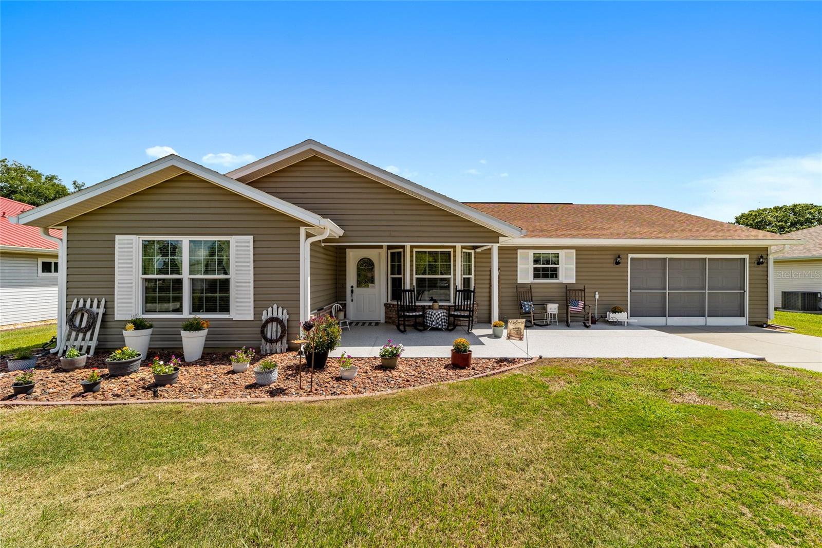 This stunning home is located in the active adult community of Marion Landing. As you pull up to this spacious home you will immediately notice the welcoming front porch inviting you to sit and relax or to enjoy your morning coffee. Upon entering you will appreciate how well this home has been lovingly maintained. The kitchen, immediately to your right boasts oak cabinets, Corian counter tops and Maytag stainless steel appliances. The living area, which is open to the dining area, is open and airy and the skylight provides a beautiful ambiance. The spacious Florida room is just off of the living/dining area, and provides extra living space. You will have no problem finding extra room when your friends and family come to visit. There is also a large lanai which is perfect for entertaining or relaxing. A large room which can be used as a hobby room, den or office and two spacious bedrooms complete this beautiful home. The primary bedroom has a walk-in closet and an en-suite. Attached to the home is the oversized one car garage with plenty of room for your car and a workshop. A large list of updates make this all the more reason to move into this well maintained home, including, new roof 2021, HVAC 2019, water heater 2025 and Pella windows in 2020. An irrigation well allows you to keep your lawn looking beautiful! Marion Landing boasts a low HOA which covers water, sewer and trash, as well as access to all the amenities. The clubhouse features a large ballroom, kitchen and library. There is an outdoor pool, shuffleboard, pickleball, tennis and basketball. A fitness center, billiards and an 8-lane bowling alley add to the reasons to make Marion Landing your home. Call and make an appointment to see this spectacular home today!