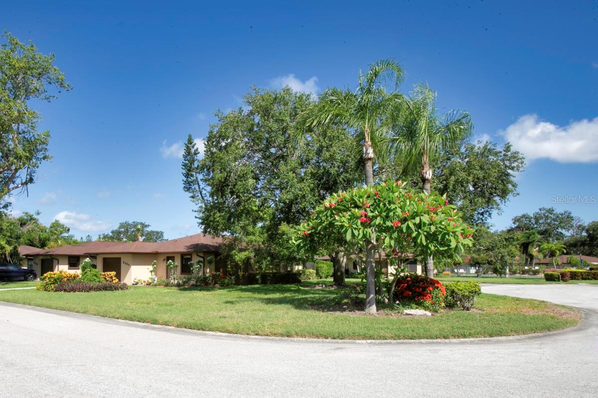CAMBRIDGE VILLAGE WEST has LOW HOA FEE of $275 monthly. The $275 monthly provides cable, WIFI, heated pool/rec center, maintains the lush landscaping and outside paint. This WELL-BUILT, FRESHLY PAINTED inside and out, single family home on a CORNER LOT has a 1 CAR GARAGE with a new garage door opener and water heater. The well-maintained 2018 HVAC system had the capacitor recently replaced, the condenser coils and cover cleaned. Plus air handler cleaned including coils and blower fan. Also regular filter replacements. This SINGLE FAMILY HOME's beauty goes beyond the STURDY CONCRETE/STUCCO WALLS and 2017 shingled roof. The UPDATED/UPGRADED inside is a DESIGNER INSPIRED 2BD/2BTH with FRENCH DOORS leading out to the exclusive, x-tra large AIR-CONDITIONED FLORIDA ROOM (it is uncommon to the neighborhood to have 2 lanais). It is used as office/den adding 170 square feet to total 1,462 total square footage. That makes this home priced lower sq ft than other recent sales. The chef's dreams are fulfilled in the spacious kitchen with plenty of beautiful QUARTZ countertops that have a subtle beige veining and everyone's favorite shaker cabinetry. The kitchen wall has been removed, providing an OPEN FLOOR PLAN! The rooms are highlighted with new lighting, no popcorn ceilings and stunning wood-look new tile flooring. There is an INDOOR LAUNDRY ROOM/PANTRY/COFFEE BAR that leads out to the GARAGE. This PET FRIENDLY, 55+ neighborhood has planned get-togethers including parties/dinners at the recently decorated and clean club house with a library and kitchen. You'll enjoy the HEATED POOL, shuffleboard court and BBQ grill and appreciate the easy access. The FLORIDA LIFESTYLE doesn't end at your own piece of paradise. Take a 5 mile drive to ANNA MARIA ISLAND for the green flash sunset on the serene GULF WATERS. You can take the free island trolley to the tiki hut restaurants or beachy boutiques for fun shopping. CAMBRIDGE VILLAGE WEST is convenient to all your needs. Blake hospital, doctor's offices, GT BRAY park and the YMCA are a few blocks away. Your choice of grocery stores and big box store/gas station are less than 2 miles from home. This location is convenient to St. Armand's circle, Ringling museum, IMG Academy, marinas, golf courses, the arts/entertainment districts of Sarasota or Bradenton's Riverwalk, all the fine dining/fast food favorites, movie theatre, bowling and Robinson Preserve. Our own SRQ airport is a nice benefit for living in the GULF COAST of FLORIDA. It doesn't take long to drive to I-75 for trips to Tampa, Orlando or south to Naples or Miami. Don't miss out on this opportunity to live in a WEST BRADENTON updated single family home with a garage for this price!
