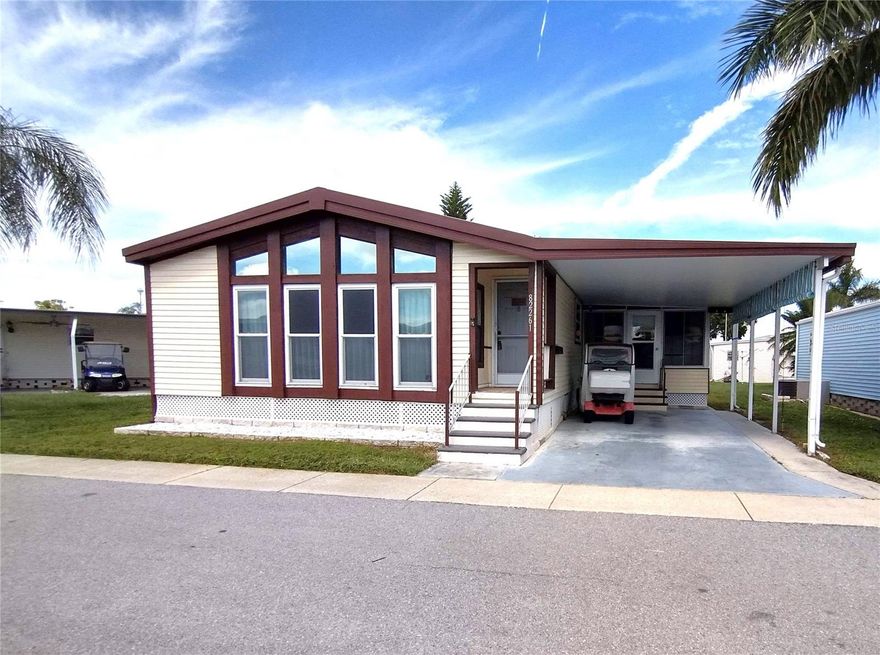 This 1146sq ft home, plus additional 200 square foot enclosed Florida room, offers 1338 square feet of living space. This home boasts high ceilings, laminate flooring, and a separate office space. Inside this home you will find open space living with laminate flooring throughout. The living room has a beamed ceiling and chalet style wall of windows. There is a formal dining area with built in lighted cabinets to display your items. The kitchen is spacious and has bountiful cabinet space and a breakfast bar. There is a doorway off the kitchen that is where you will find the built in office. The office opens to the enclosed Florida room and laundry room. No walking outside to a shed to do your laundry. Off the hallway from the dining room, you will find the guest bathroom with shower/tub combo. The guest bedroom is just across from the guest bathroom and has a its own walk-in closet. The master bedroom and en-suite bathroom spans the whole back of the house. Off the master en-suite is a walk-in closet. The home has central AC/heat with UV light and is serviced every 2 years. The low monthly maintenance fee of $130/mo makes Florida living affordable. Golden Gate is a 55+ resident owned community with private maintained roads which offers many amenities to its residents. There are men’s and women’s clubs, shuffleboard, horseshoe pit, bocce ball court, heated pool and spa, social activities, planned outings, movie nights, and so much more. The community is located close to a Walmart Super Store, or you could take your golf cart. The store has designated golf cart parking! For the golf enthusiast there is the Mainlands Gulf Club just a signal light away. It is a public 18-hole Florida links style course. There are numerous stores and restaurants within a minute's drive away and is close to major airports and interstates. Best of all it is 15 minutes from the award-winning Florida Gulf Beaches. The listing price includes the cost of the landshare which is valued at $45,000. Pet friendly with 1 pet allowed up to 20 pounds. Buyer to verify all measurements and restrictions and rules of the community. Requires community approval of application.