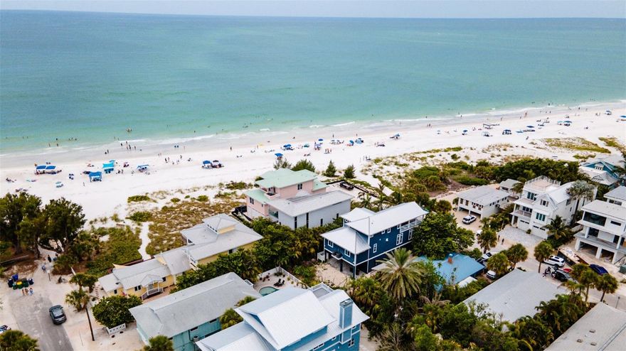 Beachfront Oasis is elegant European design luxury home that has been professionally decorated and has spectacular  beach views from every room. Floor to ceiling glass allows full views of the beach and aqua tropical gulf waters. The clean lines of the homes upscale design allow you to just sit back, relax and enjoy the stunning open beach view on any of the four beachfront decks. Indulge in the home’s high-end finishes from the moment you walk in the door including a private elevator to all floors. Once you’re on the main level you’re welcomed by breathtaking views, the high-end kitchen and open concept living and dining areas that are perfect for entertaining. The high-end kitchen offers stainless steel appliances, induction stove top and built-in oven. The kitchen island provides the perfect spot for entertaining as you prepare a gourmet meal or simple treats. On the top level there are two separate master suites, both with king beds, their own private baths and private beach front balconies. On the main level, off the living room, is another bedroom with a queen bed and another private balcony. The outdoor area features a private pool and beach area with outdoor lounge chairs plus a table and chairs to enjoy poolside refreshments. Beachfront Oasis is ideally located on the quiet north-end of Anna Maria Island. It is one block from the charming Pine Ave shops, restaurants and attractions. On the bayside of Pine Ave is the Anna Maria City Pier and Waterfront Restaurant.
