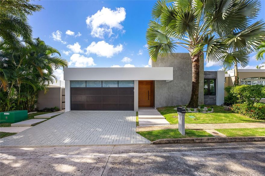 This captivating architectural masterpiece is located in La Villa de Torrimar. The contemporary Model 5 fully remodeled design home sits on a 561 square meter lot and features 2,650 sq ft. The impressive outdoor boasts a stunning covered terrace, and gorgeous pool. Ideal home for entertaining family and friends. Modern and elegant, with unique personality and exquisite finishes. This turnkey property features a spacious living room, dining room, family room, a gourmet kitchen and a powder room. Fully equipped kitchen with top of the line appliances. Four bedrooms, and three bathrooms. A luxurious master suite with a private "en-suite” resort style bathroom and two closets. One junior suite with ensuite bathroom. Two bedrooms and a bathroom and a convenient laundry area. 

La Villa de Torrimar is a unique community where residents can enjoy a variety of facilities including basketball court, tennis courts, gazebo, club house, and playground. Additionally, the neighborhood has 24-hour security. Call us today to coordinate a private showing.