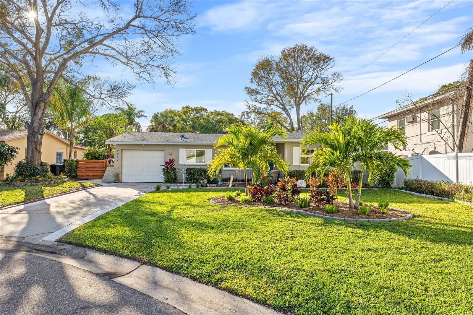 Welcome to this beautifully updated 2-bedroom, 1-bath concrete block home with a 1-car garage, ideally situated on a quiet cul-de-sac in desirable NE St. Petersburg. This move-in-ready gem features new tile flooring throughout (2023), new windows (2020), and a renovated chef’s kitchen complete with 42" cabinets, pull-out drawers, a gas range, stainless steel appliances, and an extended island perfect for entertaining . Major systems have been upgraded, including a tankless gas water heater (2017), AC unit (2018), shingle roof (2018), and a 200 AMP electrical panel (2000). The oversized yard is fully fenced and equipped with a Rainbird irrigation system, plus an 8x12 “Tuff Shed” for additional storage. Enjoy the fantastic brick-pavered screened porch, great for hosting—Just one block from the canal ideal for kayaking and paddleboarding, 1.3 miles to Sunlit Cove Boat Ramp, and 3.2 miles to Weedon Island Preserve- a 3,700-acre nature sanctuary with trails, rich history, and a panoramic observation tower. Located minutes to Tampa, TIA, and only 5.3 miles to Historic Downtown St. Petersburg and the iconic $92-million waterfront "St. Petersburg Pier". This home offers the perfect blend of tranquility, convenience, and Florida lifestyle.