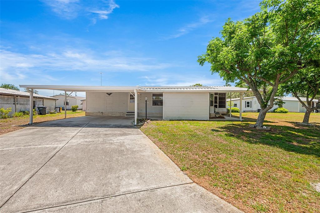 Photo of 6002 Grand Oaks Drive SE, Winter Haven, FL 33884 (MLS # P4938477)