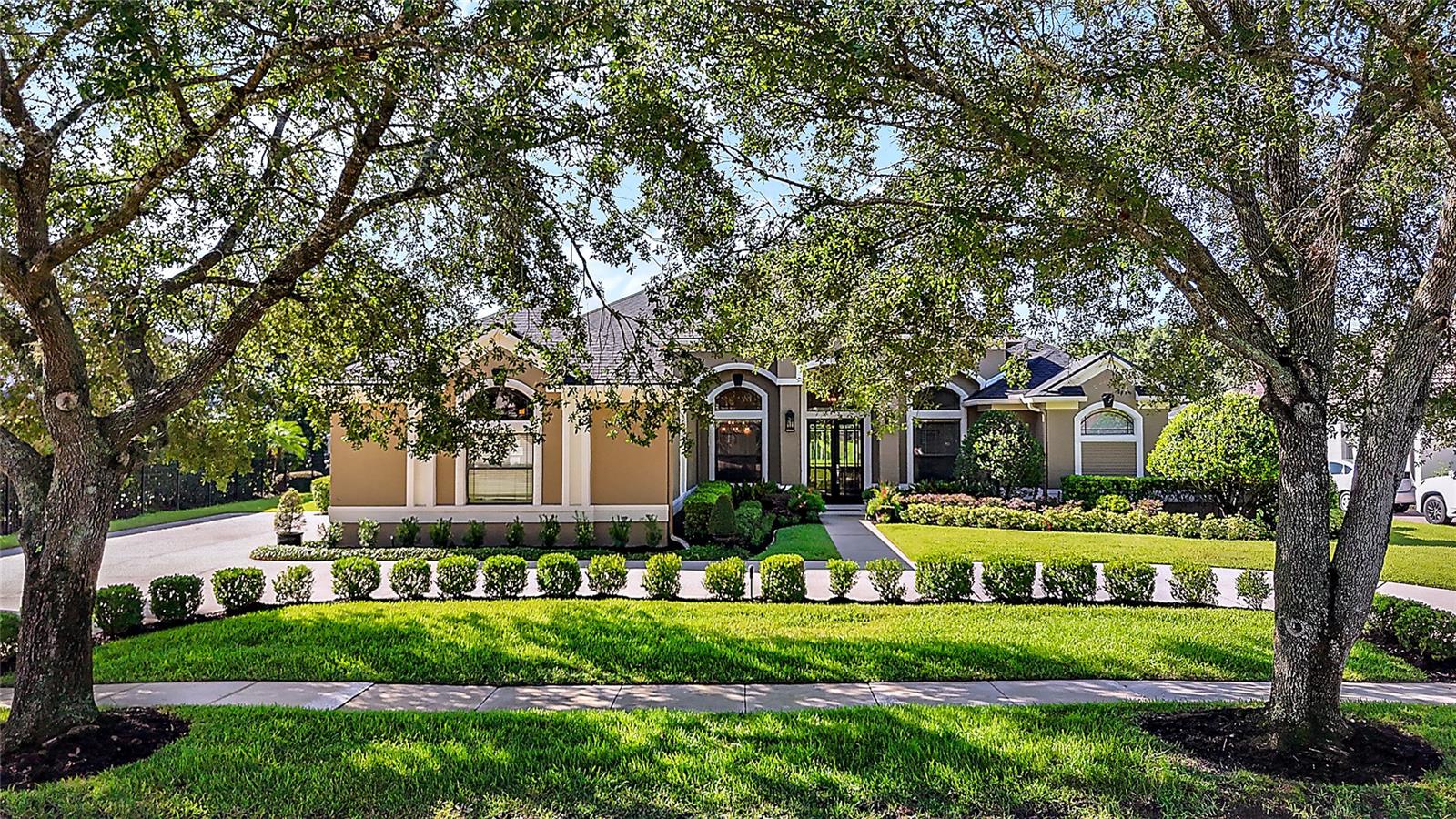 This one-in-a-million home with 4 bedrooms (one can be used as an ideal office) offers beauty, an incredible view, a gorgeous salt-water pool and spa in a premiere Winter Springs gated neighborhood! This stunningly renovated home is nestled within the highly desirable Wicklow Greens community of Tuscawilla. From the moment you drive into Wicklow Greens, the beauty of the neighborhood will capture your attention. Driving up to this single-story home on a quiet court will draw you in with its well-maintained, mature, and lovely landscaping. Sitting on a spacious 1/3 acre lot with professional landscaping, this residence offers a perfect blend of elegance and comfort.
The grand double front doors open to a breath-taking view of the pool and lake-size pond beyond. As you step inside you will find, all-new flooring, freshly painted interiors, and tastefully designed details throughout.The spacious interior with soaring ceilings and crown molding, create an airy, luxurious feel. The formal living and dining rooms are ideal for entertaining, while the updated open-concept kitchen boasts quartz counters, a generous eating area, and a cozy fireplace in the adjacent family room - all of which have gorgeous views of the pool and pond.
This special home features 3/4 bedrooms and beautifully renovated bathrooms, including the primary and guest bath. The home’s interior is professionally designed, showcasing modern updates and stylish accents.
Enjoy outdoor resort living at its finest with a magnificent saltwater pool and spa, both recently refreshed with a new pool/spa filter in 2024. The pool area is complemented by a huge covered lanai and a screened pool enclosure—perfect for relaxing or entertaining—overlooking tranquil pond views. The pool deck has been freshly re-coated and a child protective fence with self-closing gate is included.
Additional highlights include a three-car garage with a newly epoxied floor, a roof replacement in 2020, and new indoor and outdoor lighting installed in 2024. The community offers a wealth of amenities, including proximity to Tuscawilla Country Club for golf and social activities, with optional membership. Conveniently located near excellent restaurants and amenities, this home combines luxury, convenience, and an inviting lifestyle.
Don't miss the opportunity to make this gorgeous, move-in-ready home your own!
