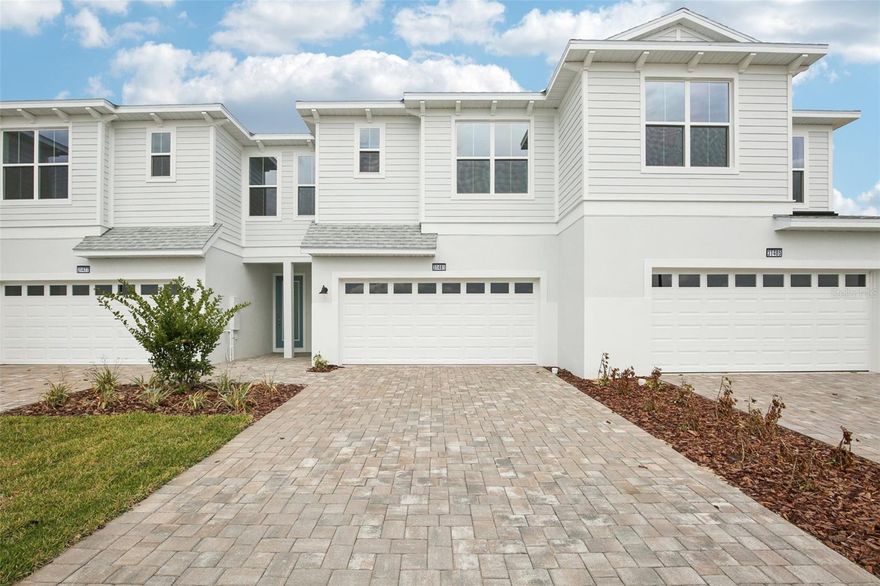 Located in the gated community of Isla Mirada within the Mirada master-planned development, this Aruba floorplan offers a functional two-story layout with upgraded interior finishes and abundant natural light throughout. The home features three bedrooms, two and a half bathrooms, and an open-concept main living area designed for comfortable everyday living and entertaining. Large windows allow for a strong amount of natural light, enhancing the main living spaces. Luxury Vinyl Plank flooring extends throughout the main level, and the kitchen showcases upgraded light blue cabinetry, creating a distinctive focal point with a modern coastal feel. Upstairs, the primary suite is privately situated along with two additional bedrooms and a full bath. A 2-car garage provides added storage and convenience. Enjoy a covered lanai overlooking a peaceful pond view with no rear neighbors. Community amenities include gated access, proximity to the 15-acre Mirada Lagoon, and convenient access to shopping, dining, and major roadways.