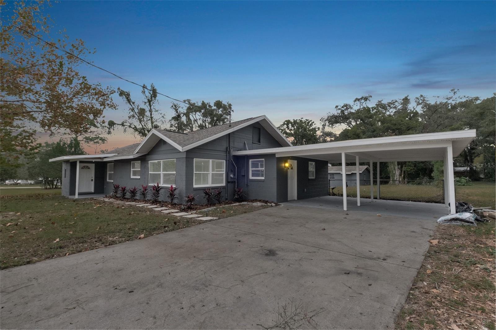 SELLER IS OFFERING $10,000 TOWARDS RATE BUY-DOWN OR CLOSING COSTS!!!
Welcome home! This completely renovated home features brand new everything, such as a new roof (2023), windows (2023), a/c (2023), luxury vinyl flooring (2023), tile (2023), interior and exterior paint, and landscaping. Additionally, this home offers 2,845 sqft with 4 large bedrooms, 3 bathrooms, a 2-car carport, a detached oversized one-car garage, and 1.27 acres! Upon entering the home you will notice the open concept that the home offers which includes a large and spacious living room as well as a huge kitchen that features new cabinets, hardware, stainless steel appliances, and beautiful brand new granite countertops that include a peninsula to provide space for extra seating. In addition to the large kitchen, there is also a separate room off the kitchen that could be used as a breakfast nook, office, etc. This is the perfect layout for family get-togethers and celebrating the holidays! As you walk to the left of the home you will pass through the sliding farmhouse door and enter into the large main bedroom that includes a large walk-in closet as well as its own bathroom with marble tile throughout. Off the living room you will enter into a hallway, at both ends you will find the second and third bedrooms with the second bathroom being in between. As you pass through the kitchen, you will enter into the second part of the home which contains a third bathroom, laundry, and plenty of space to be used a playroom, game room, etc. Continuing through this room you will find the fourth bedroom which has its own private entrance off the carport. The back of the home also includes a huge back sunroom to sit and enjoy the beauty of your backyard! This home has it all, from new flooring, paint, kitchen, and bathrooms to new windows, a/c, roof, landscaping, etc. This home will not last long; make an offer today!