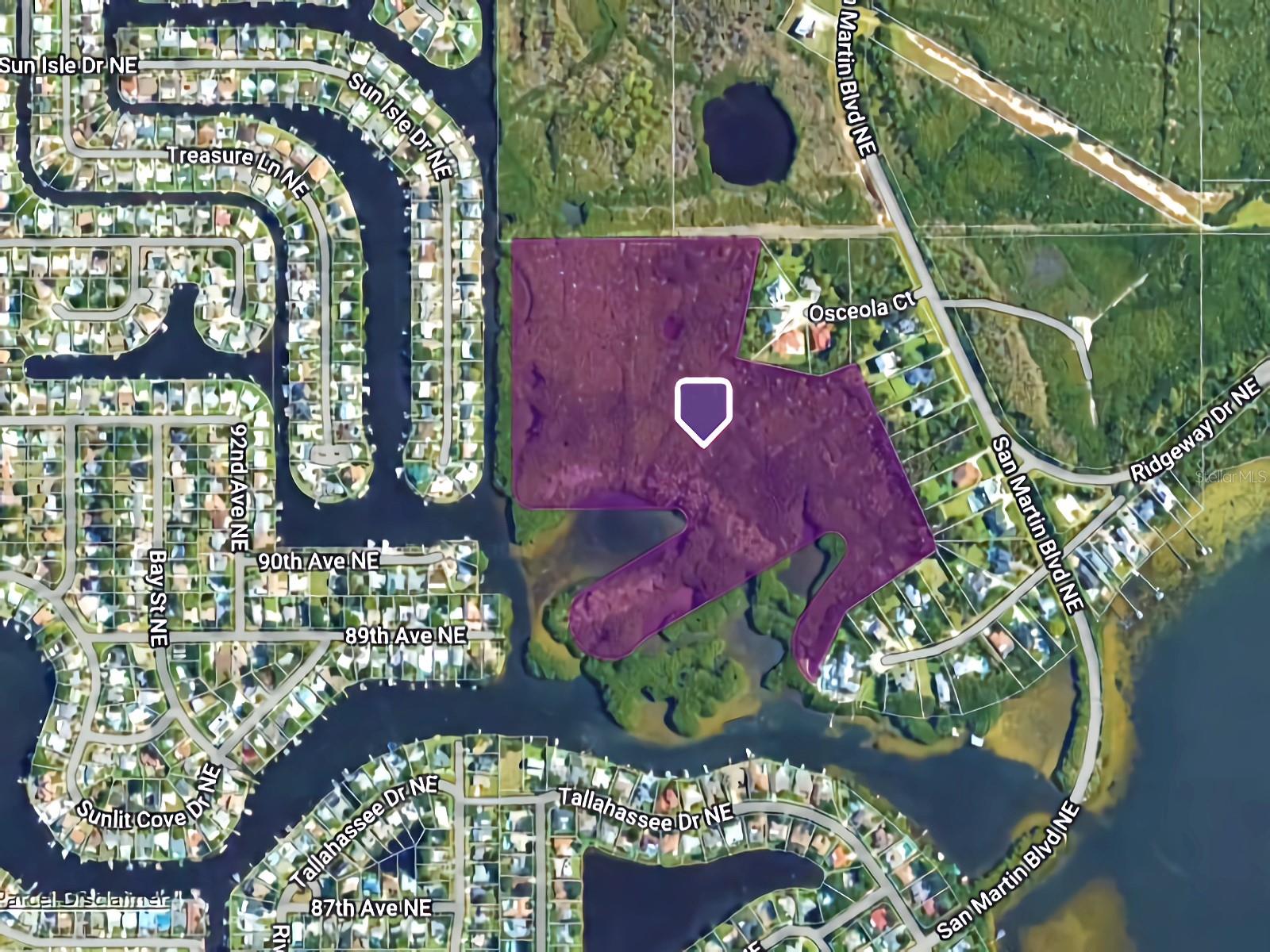 This one-of-a-kind property cannot be duplicated! Offering 1.7 acres (non-continuous) upland surrounded by 36 acres of diverse protected nature. The ultimate in privacy. The property has canal access to connect to Riviera Bay! Mitigation is required (reach out for details). The property has an access easement from San Martin Blvd NE. Drawing available for driveway to the recommended homesite. Located in an area of well-maintained exclusive homes. Just minutes away from the beautiful Weedon Island Preserve, perfect for outdoor enthusiasts. Prime Location: Only 12 minutes to Tampa Bay and 15 minutes to the restaurants of Central Ave. Everything from beaches, boating, fishing, golf, schools, and doctors are nearby. A survey is available. Reach out for more information.