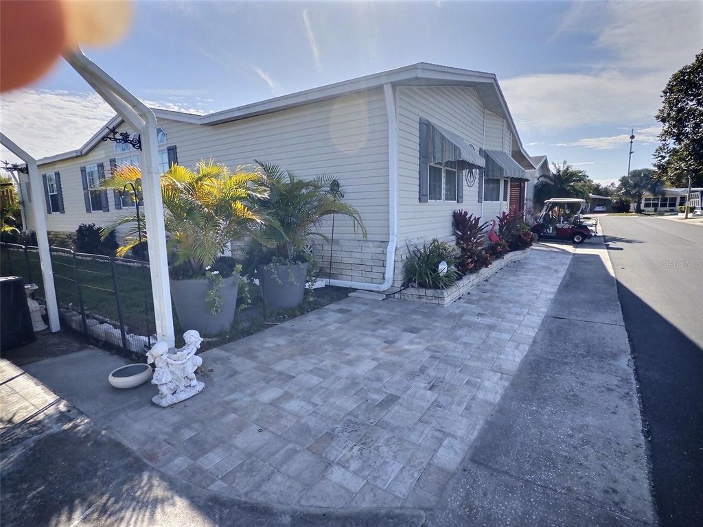 Photo of 107 Pindo Palm Street W, Largo, FL 33770 (MLS # TB8467351)