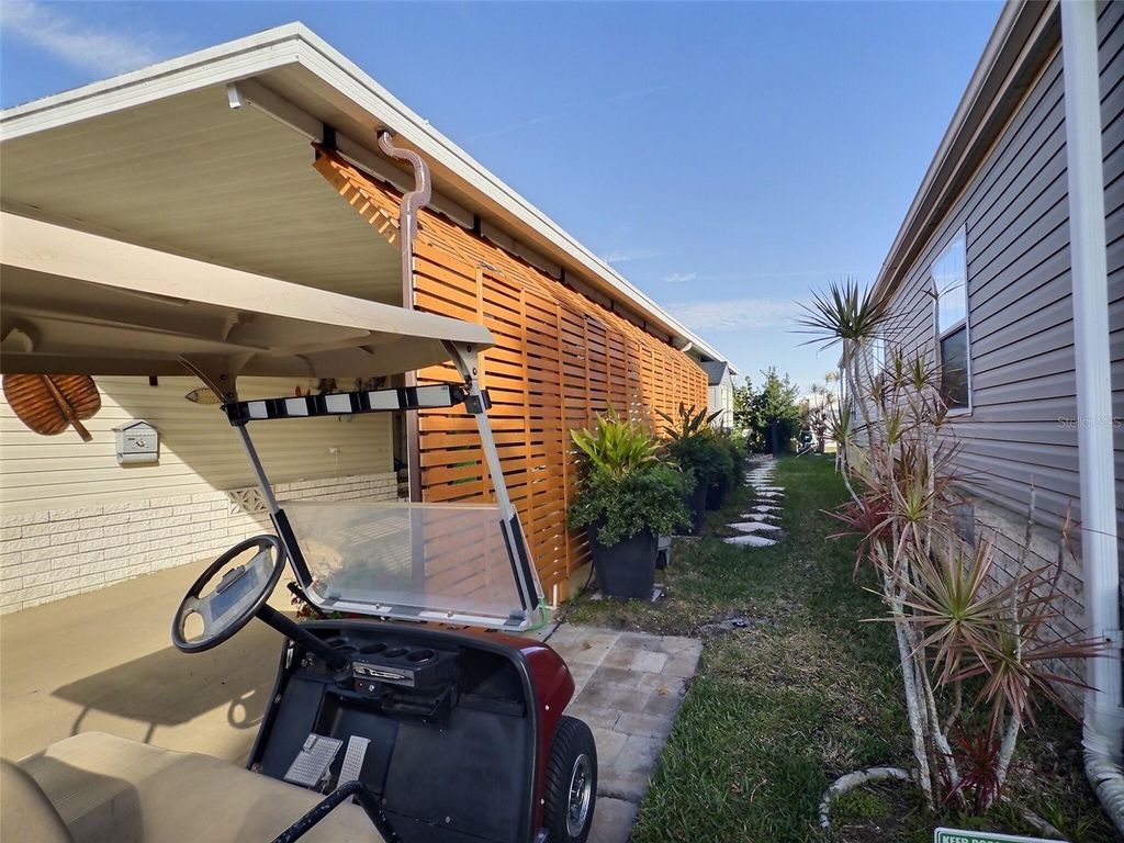 Photo of 107 Pindo Palm Street W, Largo, FL 33770 (MLS # TB8467351)