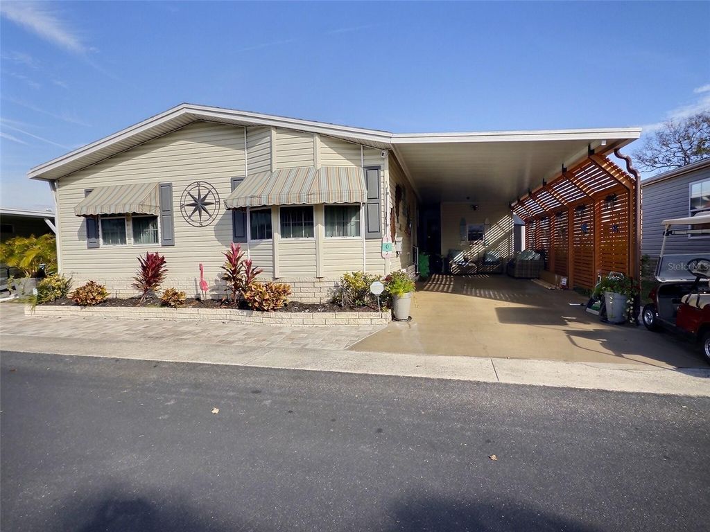 Photo of 107 Pindo Palm Street W, Largo, FL 33770 (MLS # TB8467351)