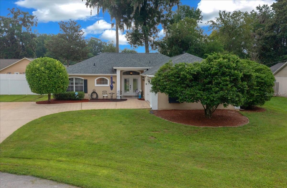 Welcome home to this lovely updated three bedroom two bathroom home on an oversized lot on a cul-de-sac! 2021 Roof. No HOA. Spacious primary bedroom with an ensuite bathroom that has a jetted tub and large shower, separate linen closet and two huge walk-in closets. Custom built-ins in every bedroom closet. Home also features skylights, wood burning fireplace, updated lighting fixtures, plantation shutters throughout, eat-in kitchen with pantry, laminate and tile flooring (no carpet), an oversized back patio, and a completely fenced yard. Washer & Dryer included. Whether you are seeking tranquility or a space to host, the backyard layout is ideal. Convenient access to Santos Bike Trails, the Ocala Drive-In Theater, Ocala Horse Park, and Downtown Ocala. Must see to appreciate.