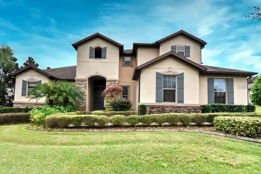 Elegant and beautifully upgraded, this Sullivan Ranch (former model) home offers nearly 4300 sq. feet of living space w/a floorplan perfect for family living & entertaining! Inviting entryway ushers guests past the first floor office and beckons them to an open living area which includes a gourmet kitchen boasting wood cabinetry, crown moulding, stainless steel appliances (twin dishwashers) & granite countertops. Entertain guests in the large dining area & expansive great room with coffered ceilings. Screened lanai is open to the home w/ zero-corner sliding glass pocket doors. A spacious primary suite offers double walk-in closets, a beautiful soaking tub, large walk-in shower & double sink vanity. Three secondary bedrooms, 2 full baths, large laundry room, (with 2 washer/dryer hookups) and garage entry complete the first floor. On the second level you'll find a fabulous bonus room complete w/wet bar, glass tile wall, & built-in wine refrigerator, the fifth bedroom and full bath. Trees include Avocado, Lemon, Mulberry, Guava & Loquat.