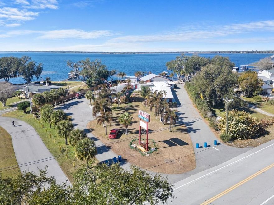 Check out this cozy hotel/cafe with approximately 176' of waterfront on Alligator Lake. There are plenty of possibilities on this property, you must see to appreciate. Located in the fast growing city of St. Cloud, this property features a total of 4 buildings: one building with lobby area, a second building with a kitchen/cafe area, a separate area with a total of 10 bedrooms with baths (5 bedrooms on each side), and a covered lounge/pavilion area where you can enjoy the relaxing water view during the day, and breathtaking sunsets in the evening. There is a boat dock/ramp area to access Alligator Lake. Alligator Lake is a key part of the Alligator Chain of Lakes - connected by canals. This lake is known for fresh water fishing (largemouth bass), boating, alligator spotting, and bird watching. Also, know as the "Headwaters of the Everglades". This property is approximately 7 minutes to the eco-friendly community of Harmony and 45 minutes to Disney or Melbourne and its beaches!