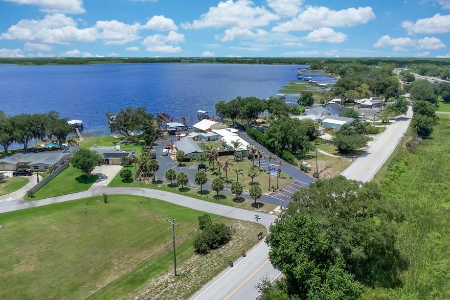 Check out this cozy hotel/cafe with approximately 176' of waterfront on Alligator Lake. There are plenty of possibilities on this property, you must see to appreciate. Located in the fast growing city of St. Cloud, this property features a total of 4 buildings: one building with lobby area, a second building with a kitchen/cafe area, a separate area with a total of 10 bedrooms with baths (one building features 5 units with 2 bedrooms each and a separate building features 5 units with 1 bedroom each), and a covered lounge/pavilion area where you can enjoy the relaxing water view during the day, and breathtaking sunsets in the evening. There is a boat dock/ramp area to access Alligator Lake. Alligator Lake is a key part of the Alligator Chain of Lakes - connected by canals. This lake is known for fresh water fishing (largemouth bass), boating, alligator spotting, and bird watching. Also, know as the "Headwaters of the Everglades". This property is approximately 7 minutes to the eco-friendly community of Harmony and 45 minutes to Disney or Melbourne and its beaches!