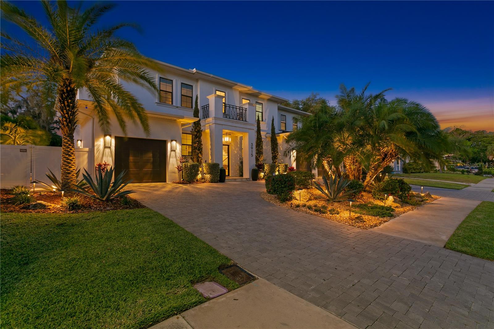 Welcome to this stunning Beach Park area home situated on a huge NO FLOOD ZONE, 90 x 127 ft lot. This home has an oversized circular driveway for easy access to your 3 car garage while allowing a multitude of parking spaces. Step through the gorgeous black iron paned glass front double doors into the soaring 2 story foyer beautifully lit by a retractable chandelier that can be lowered for easy cleaning and upkeep. Your eyes are immediately drawn from the foyer, through the family room, to the sparkling waters of the saltwater pool and lush landscaping. Off to your left is a space perfect for a home office or a small cardio room. Next to that is the beautifully finished elevator followed by the entrance to the downstairs guest suite which is like a min-owners suite outfitted with a morning bar, large bathroom, walk-in closet and private exterior side entrance. The family room is open on one side to the lanai with views of the pool and on the other side to the enormous kitchen. The kitchen features an oversized island, 8 burner Thermador gas range with hood, Subzero refrigerator, and Wolf microwave and built in Wolf coffee maker, as well as a large walk-in pantry. The kitchen/dining area overlooks the beautiful yard and has space to fit a table of 10+. Upstairs features 4 more bedrooms plus a large bonus room. The owner's suite has his and her closets and a nice morning bar. The suite also opens to a private balcony overlooking the backyard. The backyard and pool area are lushly landscaped and very private with mature well-manicured foliage, low maintenance turf, 2 fire pits, hot tub, pool sun shelf and tons of space to make this your own 5 star private oasis. You will also appreciate the full house generator in addition to the hurricane windows and not being in a flood zone giving you the peace of mind of safety and security that helps make a house a home. Other notable upgrades include: epoxy garage flooring and electric car charger, remote controlled electric bedroom shades, retractable screens on the lanai, abundant landscape lighting and recycled water irrigation, indoor and outdoor speaker system, 10 camera and recording (NVR) Unifi system with full property meshed WiFi and Unifi router.