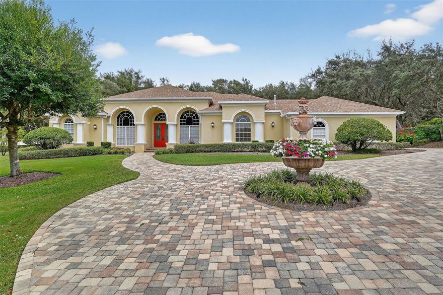 Live the Luxe Florida Lifestyle in Hampton Hills! Step into elegance at this stunning estate nestled on over an acre of lush, park-like grounds. With ultimate backyard privacy and over 2,900 sq. ft. under air, this home combines timeless sophistication with modern comfort — inside and out. Highlights You'll Love: Designer upgrades throughout — from motorized Roman shades to a whole-house generator 2019 and a central vacuum system. Remodeled in 2016 spa-worthy primary bath featuring Turkish marble, towel warmers, a five-head shower, and a jacuzzi spa tub. Gourmet kitchen perfection with a double oven, brand new gas cooktop,(all with natural gas) oversized walk-in pantry, and sleek door-in-door refrigerator — perfect for the passionate chef. Three spacious ensuite bedrooms plus a stylish half-bath for guests. Den with built ins and a murphy bed for guests. Climate-controlled 3-car garage with industrial epoxy flooring — the ideal space for your luxury toys. Outdoors, entertain in style with your built-in summer kitchen complete with grill, sink and mini-fridge. Or unwind in your 6-seater hot tub surrounded by lush landscaping, a stately fountain, and ambient lighting that makes the home glow after sunset. New shed to store all your outdoor toys or tools, could also be used as a she shed, unlimited options. More perks: New HVAC systems 2016 & 2019, new well pump 2021, full security and sound systems. This dream home can be yours! This home comes with a Citrus Hills Country Club membership that is optional! HOA fees are only seventy five dollars per year and the neighborhood is one of the friendliest in Citrus County! Beautifully landscaped, the pavered driveway and stately fountain add to the beauty of this over an acre property. Come take a drive by at night to see why one neighbor said this house ''looks like a fairytale''. The property is beautifully lit at night with new post lights and new sidewalk lights in 2021. Experience the Florida dream — privacy, luxury, and effortless elegance — all wrapped in one unforgettable address.