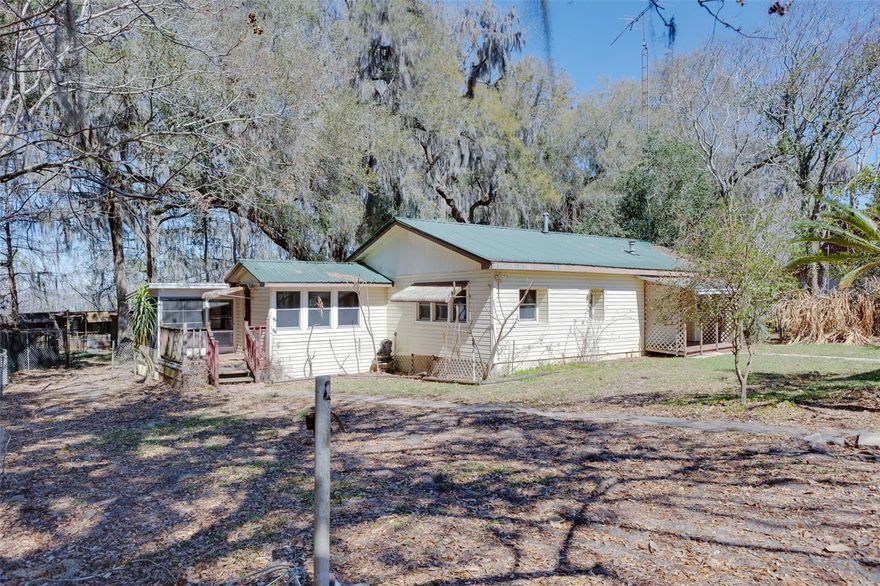 Canal Front to Lake Bryant. Huge .90 acre fenced yard with 2 car detached Garage, GreenHouse, Multiple sheds, boathouse & more.