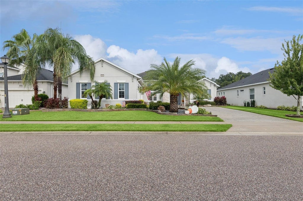 Photo of 8400 Bridgeport Bay Circle, Mount Dora, FL 32757 (MLS # O6447691)