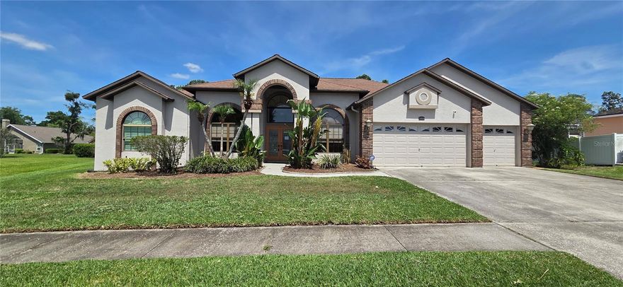 Welcome to this well-maintained 4-bedroom, 3-bath single-family pool home offering 2,866 square feet of living space in the desirable Bloomingdale Ridge community with low HOA fees. Situated on a spacious one-third acre cul-de-sac lot, this home features a 3-car garage, soaring 12-foot ceilings in the main living areas, and updated bathrooms throughout.

The home offers Formal Living and Dining Rooms, a dedicated office, and a spacious kitchen/family room combination. The kitchen is filled with natural light from a skylight and features stainless steel appliances, a built-in desk, double pantry, breakfast bar, and dinette overlooking the pool, along with direct access to the screened lanai. The adjoining family room showcases a wood-burning fireplace, ceiling fan, and triple pocket sliding glass doors that fully open to the outdoor living area.

Ceramic tile and engineered hardwood flooring run throughout the home, with carpet only in the Living and Dining Rooms. The spacious primary suite includes double walk-in closets, ceiling fan, French doors to the lanai, and a private en-suite bath. The desirable triple-split floor plan offers privacy for everyone, including Bedroom 2 at the rear of the home with its own en-suite pool bath, ideal for guests or an in-law suite. Two additional bedrooms share a third full bath.

Step outside to enjoy the expansive screened pool lanai featuring a large covered seating area, pool with heated spa, and tranquil pond views. Conveniently located near highly rated schools, shopping, dining, and with easy access to I-75 for commuting, this home combines comfort, functionality, and an exceptional location.