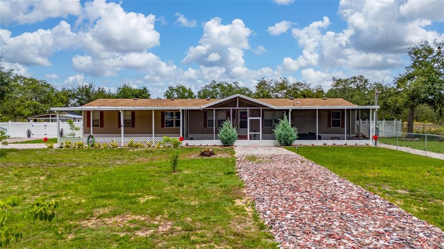 Rare opportunity to own a fully renovated, move-in-ready double-wide manufactured home on over one acre of land in Lake Wales, now featuring a brand-new roof and new A/C unit a combination rarely found at this price point.
This expansive residence offers 6 bedrooms and 3 full bathrooms, providing exceptional space for large families, multi-generational living, or anyone seeking room to grow and breathe. The oversized primary suite serves as a private retreat, complete with a walk-in closet and a beautifully updated en-suite bath with dual sinks. The home has been thoughtfully refreshed with modern flooring, an upgraded kitchen, and fresh interior paint throughout, creating a bright, clean, and contemporary atmosphere. A premium reverse osmosis water filtration system by Osmo Central Water Quality delivers clean, great-tasting water directly from the tap a rare and valuable upgrade. Enjoy the convenience of an indoor laundry area with additional storage, while the exterior truly sets this property apart: ample parking including a six-vehicle carport plus an additional single-car carport, two versatile storage sheds, and a beautifully landscaped lot featuring mature trees, colorful flowering plants, and an impressive variety of fruit trees. With over one acre of land, this property offers endless possibilities from gardening and raising animals to creating your own private retreat surrounded by nature and privacy. Few homes combine this level of space, upgrades, land, and move-in-ready condition in today’s market.
This is not just a home, it is an opportunity for lifestyle, freedom, and long-term value. Professional photos coming soon
