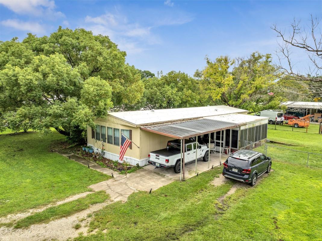 Incredible opportunity! This spacious 3-bed/2-bath doublewide manufactured home with an enclosed porch that can easily serve as a 4th bedroom sits high and dry on nearly 0.6 acres, perfectly combining the peace of country living with unbeatable access to Narcoossee Rd, Lake Nona, shopping, dining, airports, and world-famous theme parks. With a brand-new ROOF (2024), Central A/C (2015), powered double car garage, fenced yard for privacy, and an above-ground pool included, this property offers comfort today and huge potential for tomorrow. NO HOA means true freedom— with enough space to bring your RV, boats, trailers, animals, or even add an ADU, another mobile home and visionaries will subdivide for exponential returns. Yes, it needs a little TLC, but it’s priced to sell fast and properties with this land, location, and versatility don’t come around often. Don’t wait—schedule your showing now before this rare gem is gone!