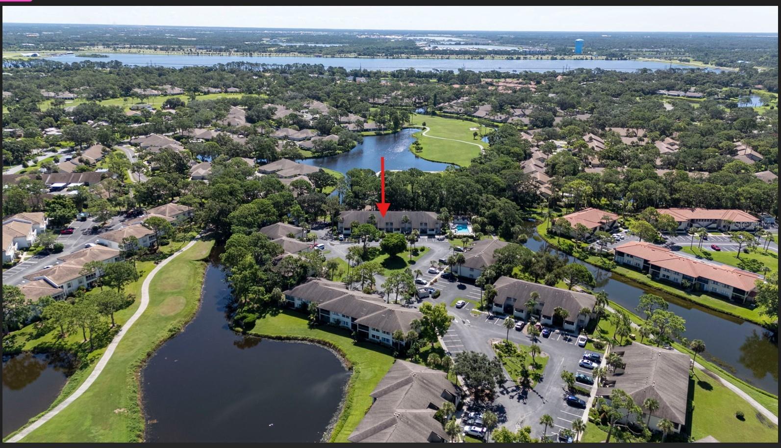 Nestled within the lush, park-like setting of The Meadows in Sarasota, this 2-bedroom, 2-bath condo in Willow Links offers a tranquil lifestyle surrounded by natural beauty and convenience. Located on the second floor, the unit features tile flooring throughout, two ensuite bedrooms, and in-unit laundry. A spacious, shaded screened-in balcony overlooks a peaceful walking trail, tucked behind the golf cart path, and the scenic 15th green—providing the perfect spot for morning coffee or evening relaxation. Enjoy the ease of a deeded parking space located right outside your door and the added bonus of being just steps from the community pool. Willow Links is ideally positioned across from The Village Shops, where you can stroll to salons, spas, popular Mona Lisa’s Italian Restaurant, and a charming lakeside courtyard.
Only 1.5 miles to Whole Foods and all the shopping and dining at University Town Center, 10 miles to vibrant St. Armands Circle, and just 12 miles to the world-renowned Siesta Key Beach. This pet-friendly community is safely outside the flood zone, and with just two stories, the building is not subject to Milestone Inspection requirements. Set on 1,650 acres of open space, The Meadows offers a serene environment with over 85 lakes, abundant oak canopies, and 14 miles of walking and biking trails—yet remains close to I-75, downtown Sarasota, Benderson Park, and all the area has to offer. This one checks all the boxes for full-time residents, seasonal getaways, or rental investment potential. Come see for yourself!