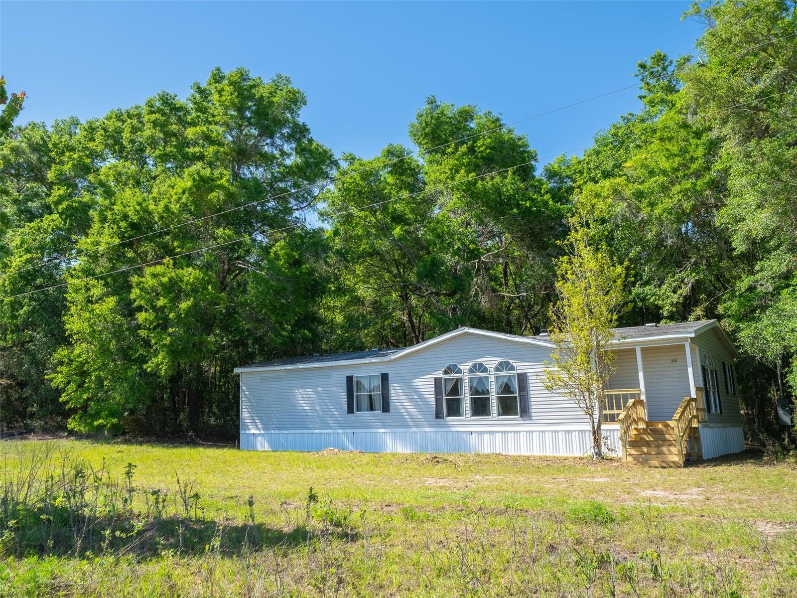 Expansive 66+ Acre Opportunity in Growing Newberry!
Discover the perfect blend of rural tranquility and modern convenience with this 66.25-acre property in Newberry, Florida. Featuring a 3-bedroom, 2-bath mobile home, this expansive land offers endless possibilities for homesteading, development, or investment.
This property features: 1,334 feet of paved road frontage, for easy access, 2 power poles and 2 septic tanks, ideal for multiple homesites, private well, fenced on three sides with a mix of open spaces and trees.
Situated just minutes from the newly opened Publix: Market at Newberry Farms, this property benefits from the area's rapid growth and increasing amenities.
With Newberry's expanding infrastructure and community-focused developments, this property offers a unique opportunity to invest in a flourishing area. Don't miss out on owning a substantial piece of land in one of Alachua County's most promising locations.