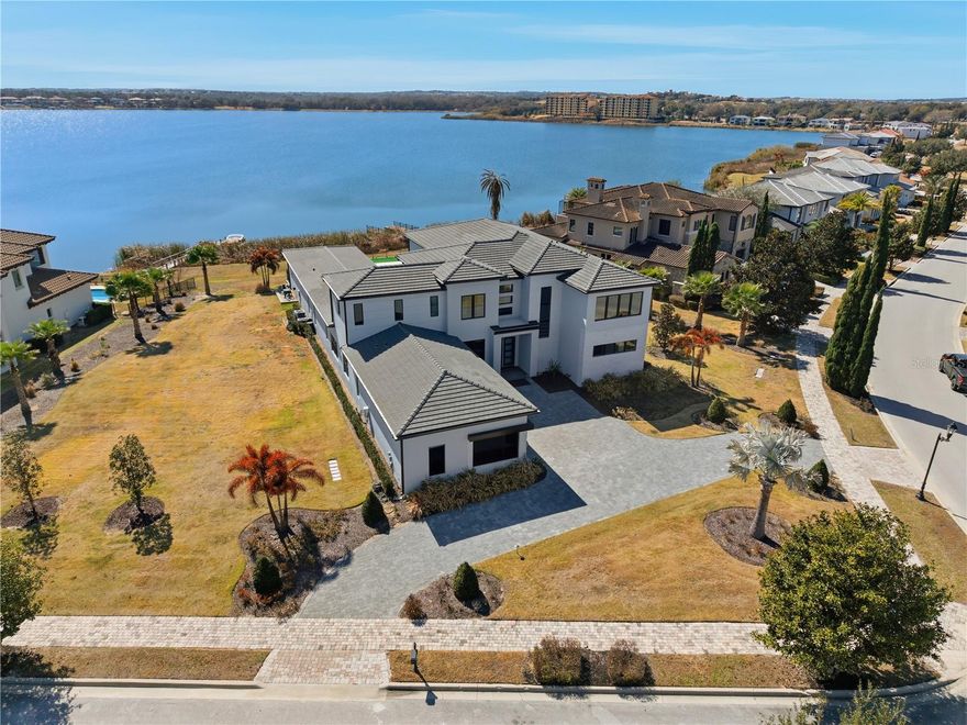 Wake up to shimmering water views and end each day in total serenity at this extraordinary Lake Siena estate in the exclusive, guard-gated community of Bella Collina. Set on an oversized one-acre lakefront lot, one of the best water lots on Lake Siena.

Designed for both grand entertaining and everyday elegance, the home features soaring ceilings, refined finishes, and breathtaking panoramic lake views throughout. The open-concept living spaces flow effortlessly into a chef’s kitchen equipped with professional-grade appliances, an oversized waterfall island, and an exceptional walk-in pantry—creating a space where design and function meet beautifully.

Outdoor living takes center stage with a resort-style lanai overlooking Lake Siena, complete with a summer kitchen, motorized screens, and multiple lounging areas. The heated saltwater pool and 360-degree spa, accented by water features and ambient lighting, create a private retreat that feels more like a luxury resort than a residence.

The home offers two lavish primary suites—one on each level—along with multiple en-suite bedrooms, a private study, and thoughtfully curated spaces throughout. 

Bella Collina delivers an unparalleled lifestyle with a private clubhouse, championship golf, spa, fitness center, tennis, fine dining, and 24-hour guard-gated security. This is more than a home—it is a rare lakefront sanctuary and an exceptional opportunity to own one of Bella Collina’s most coveted settings.