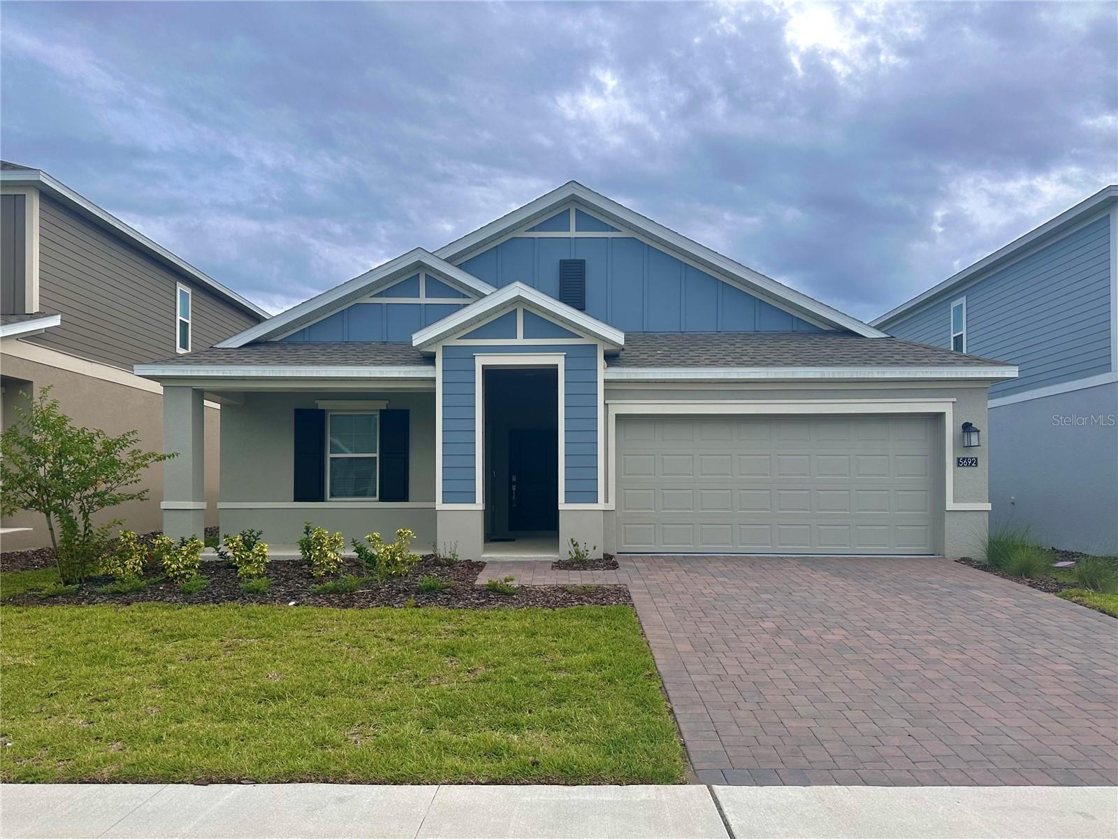 WELCOME TO THIS SPACIOUS AND VERSATILE 3BD/2BA + DEN/OFFICE HOME WITH INDEPENDENT NEXT GEN 1BD/1BA SUITE IN BRIDGEWALK: This thoughtfully designed home offers TWO COMPLETELY INDEPENDENT LIVING SPACES, each with its OWN KITCHEN, BATHROOM, WASHER/DRYER, and SEPARATE ENTRANCE. The main residence features an open-concept living and dining area connected to a modern kitchen, a flexible den/office, and a comfortable primary suite with dual-sink bath and walk-in shower. The attached Next Gen suite functions as a true second home—perfect for extended family members, guests, or a private office setup—providing its own living room, kitchenette, bedroom, and full bath. A covered patio extends the living space outdoors for relaxation and gatherings. Bridgewalk residents enjoy RESORT-STYLE AMENITIES including a pool, clubhouse, gym, pickleball courts, playground, and a navigable lake with boat ramp for kayaking, paddleboarding, or fishing. FURNISHINGS AVAILABLE TO RENT OR PURCHASE, landscaping mandatory for an additional fee.