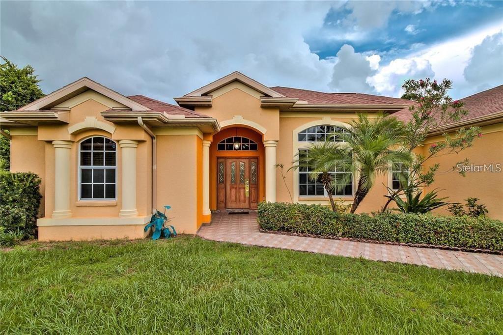 Enjoy living in this 3 bedroom, 2 bath luxury home with nearly 2400 sq ft high ceilings.PUBLIC WATER!CLOSE TO PUBLIC SCHOOLS! This is a Custom home with exquisite European design. This home features: crown molding, chair railing, wide baseboards, stainless appliances, tile floors, large breakfast nook, breakfast bar, walk-in pantry, large screened lanai with new brick paver decking, outdoor shower, private backyard, and a large laundry room with sink. This home has a split floor plan home with separate formal area. The Master Bedroom features large walk-in closet and has access to the lanai. The Master bath has dual sinks, a large garden tub and separate shower. FULLY FENCED!This home is also beautifully landscaped. Must See!