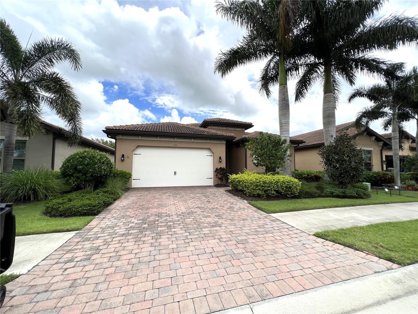 Well maintained beautiful single family house with 3 bedrooms/2 baths/1 office or den/2 car garage ( 31' deep tandem garage which has plenty of room for golf cart or kayaks). Home is built with a tile roof, and features bright light, , open and split floor plan; brick paver driveway and covered, screened lanai. Crown molding, tile floor through all areas except bedrooms, stainless appliances, plenty cabinets, and granite kitchen countertops. The master features two large walk-in closets. Toscana is a lawn maintenance included, gated community. Amenities include a community community heated pool, club room, and fitness center, tennis and bocce courts, play ground, large fire pit, all in an 8,000 sq ft Clubhouse. All centrally located, close to Venice Island and it's fabulous beaches, restaurants, and shopping. Excellent schools