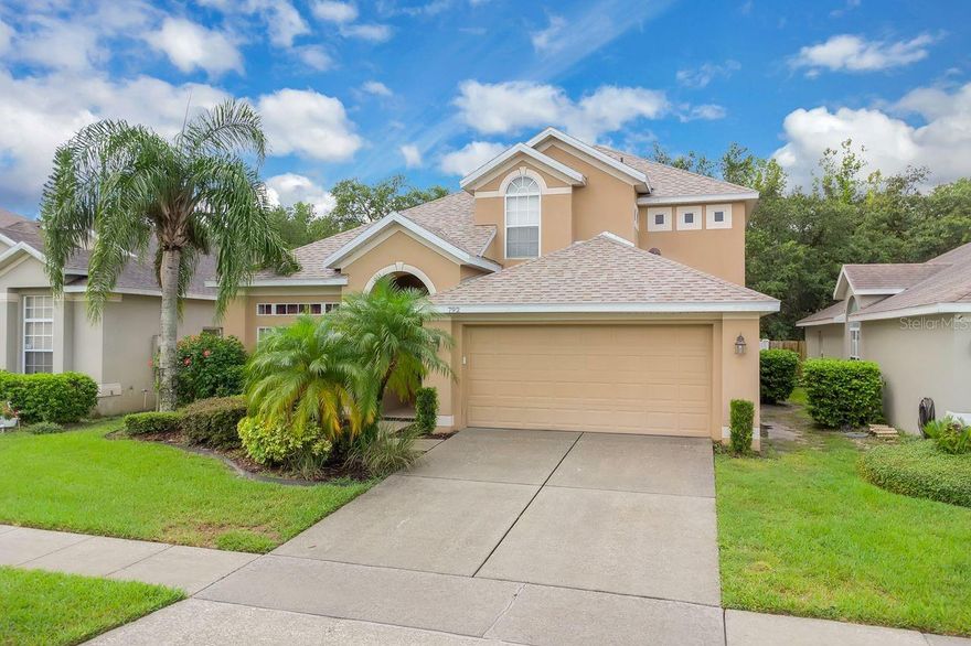 Welcome to the highly sought after gated community of Parkstone in Winter Springs, an established resort-style neighborhood known for its charm, tranquility, top rated A-rated schools, and lawn care is included with the low HOA.  Recently updated with a new roof (July 2024) and HVAC system (2020), this 2,375 sq. ft. residence offers the ideal balance of timeless elegance and everyday functionality. From the moment you step inside, you're greeted by a bright and airy open floor plan filled with natural light and soaring ceilings. The first floor primary suite is a true retreat, thoughtfully placed at the rear of the home for added privacy. Enhanced with crown molding, this spacious room exudes quiet sophistication and comfort. The en-suite bath is beautifully appointed with a five piece layout including a private water closet, separate soaking tub, glass-enclosed shower, dual vanities, a dedicated makeup station, a generous walk in closet, and a linen closet. Upstairs, you’ll find three additional bedrooms, offering plenty of space for family, guests, or a home office. Upon entry, the formal living and dining rooms are located to the left perfect for hosting. The dining room features an elegant tray ceiling and a statement glass chandelier that adds a refined touch. Throughout the home, plantation shutters dress every window, allowing light to filter beautifully into each space. The kitchen, dinette, and family room enjoy vaulted ceilings, creating a spacious and welcoming environment. The kitchen offers a breakfast bar and a dinette overlooking  the family room and the screened enclosure, allowing for seamless indoor-outdoor living and entertaining. Additional highlights include a dedicated interior laundry room and a convenient guest bath on the main floor ideal for hosting gatherings. One of the standout features of this home is its premium location backing up to the scenic Cross Seminole Trail a well loved paved trail perfect for walking, jogging, and biking. Whether you’re enjoying a peaceful morning walk or an evening bike ride, this trail offers direct access to nature and recreation just steps from your backyard. A sturdy brick privacy wall separates the home from the trail, providing a peaceful buffer while still allowing you to enjoy the convenience and beauty of this amazing outdoor amenity. Living in Parkstone means enjoying maintenance free landscaping provided by the HOA, plus a wide range of community amenities: a resort-style pool, tennis and volleyball courts, walking trails, two playgrounds, and a private dock and fishing pier straight into Lake Jessup. Just minutes from Central Winds Park, with new pickleball courts, dog park, shopping, dining, and entertainment, this home delivers an exceptional lifestyle in one of Winter Springs' most desirable communities.