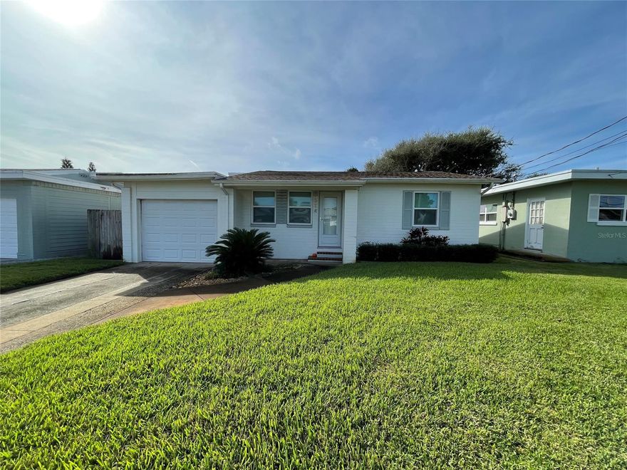 A short 75 yards to the World's Most Famous Beach! This sweet beach bungalow has a lighted and guarded (most of the year) beach approach at the end of its street! Making it a safe walk to and safe swim at the beach! This home is great for year round or vacation living! Much of this sweetie has been updated including new impact windows, new roof 2017, new kitchen and bath, a gorgeous addition with a tongue in groove roof and a carport/garage conversion! The original wood floors have been well cared for and are in the living room and both bedrooms. All other flooring is tile...not carpeting here! Truly move in ready! Move in today...beach tomorrow! ;Water: City