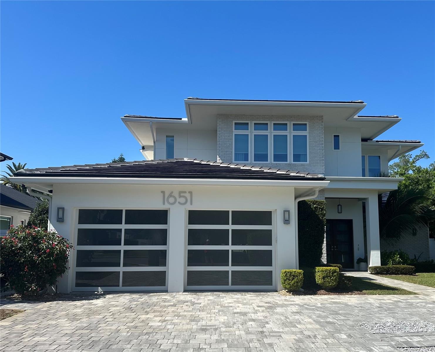 This gorgeous home has been meticulously maintained. From the moment you walk in the home, you will notice the natural light and luxurious space that this home provides. As you enter, you find the office space off to the left. As you walk forward, you will see the bar area, perfect for entertaining. The bar area overlooks the spacious family room and dining room. From these areas, you can see the beautiful outdoor space and pool. The kitchen area is complete with beautiful quartzite countertops, a gas grill, double ovens and a huge walk in pantry. The primary suite is located off of the living room area. It overlooks the pool and outdoor area. The beautiful en suite bathroom features dual vanities, a walk in shower and free standing soaking tub. Off of the kitchen is the full pool bath with a walk in shower. The backyard is truly an oasis with a covered area for relaxing, a summer kitchen and a pool perfect for enjoying the hot Florida days. Upstairs, you will find three more bedrooms. There is also a large bonus room area perfect for entertaining or just relaxing. This home is zoned for great schools and is located close to Park Avenue and all that Winter Park has to offer.